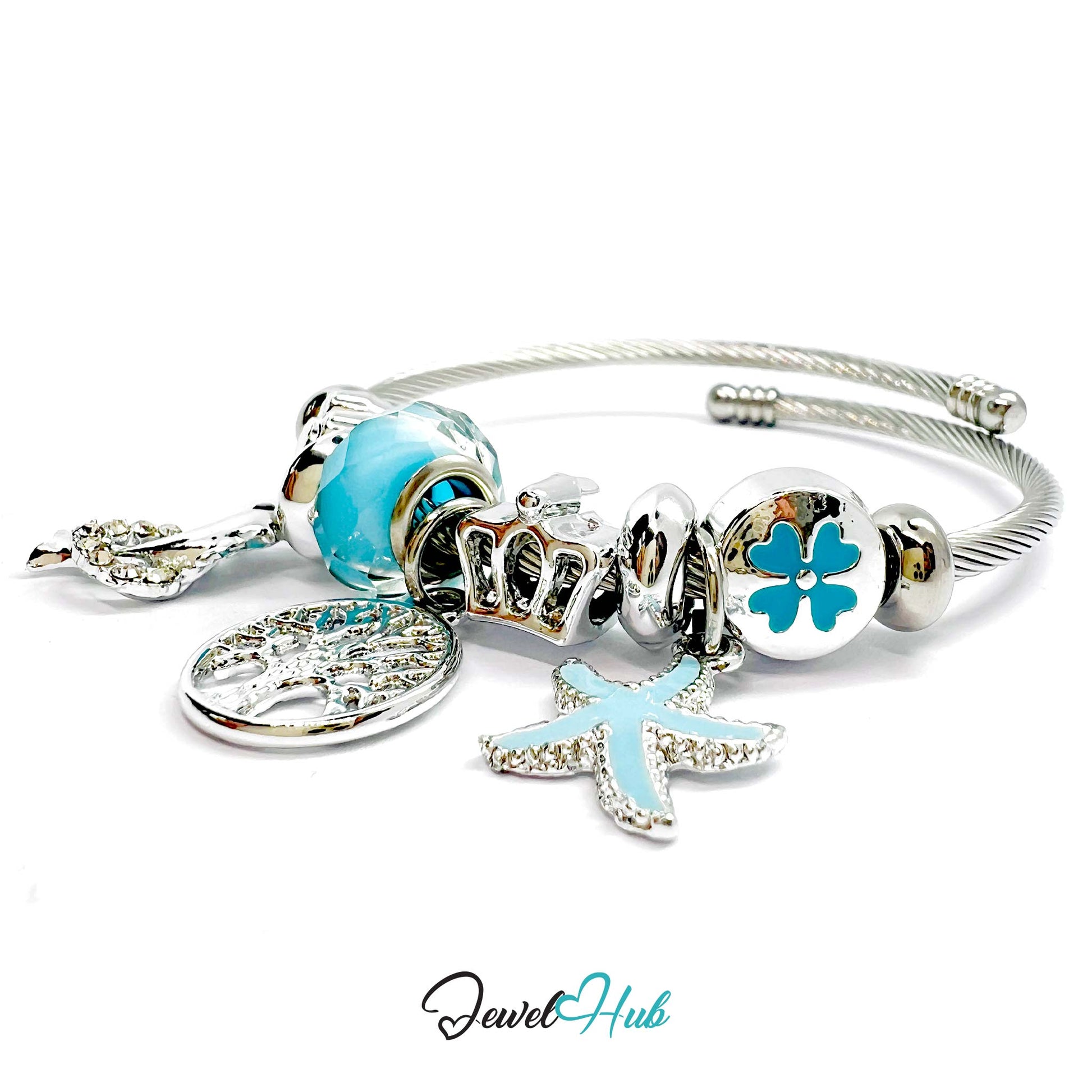 Silver bracelet with blue and clear charm beads on a white background, branded 'Jewel Hub'.