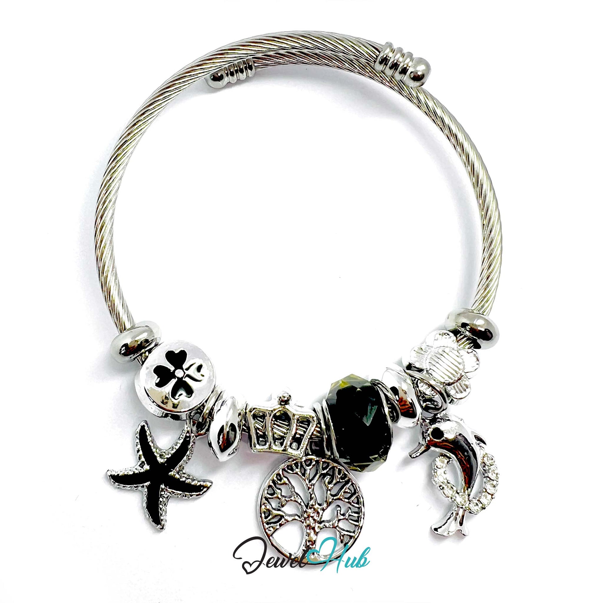 Silver bracelet with various charms on a white background