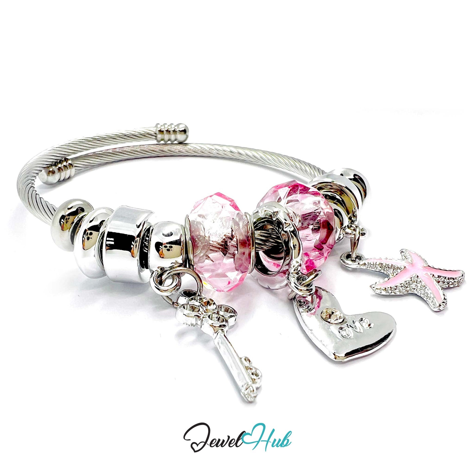 Silver bracelet with pink heart charm, starfish charm, and key charm on a white background. Brand 'Jewel Hub' visible.