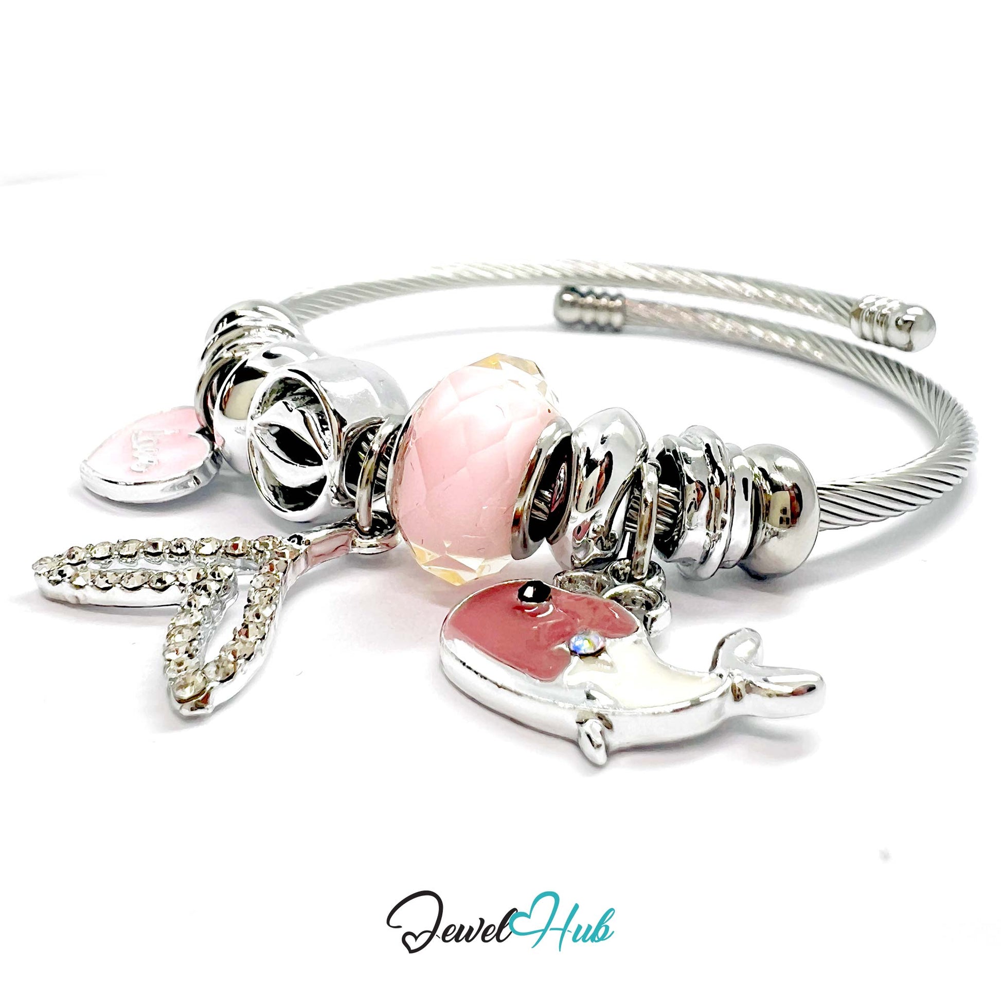 Silver bracelet with pink beads and charms on a white background, branded 'Jewel Hub'.