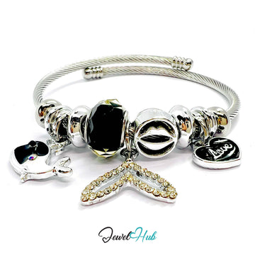 Silver bracelet with various charms on a white background, branded 'Jewel Hub'.