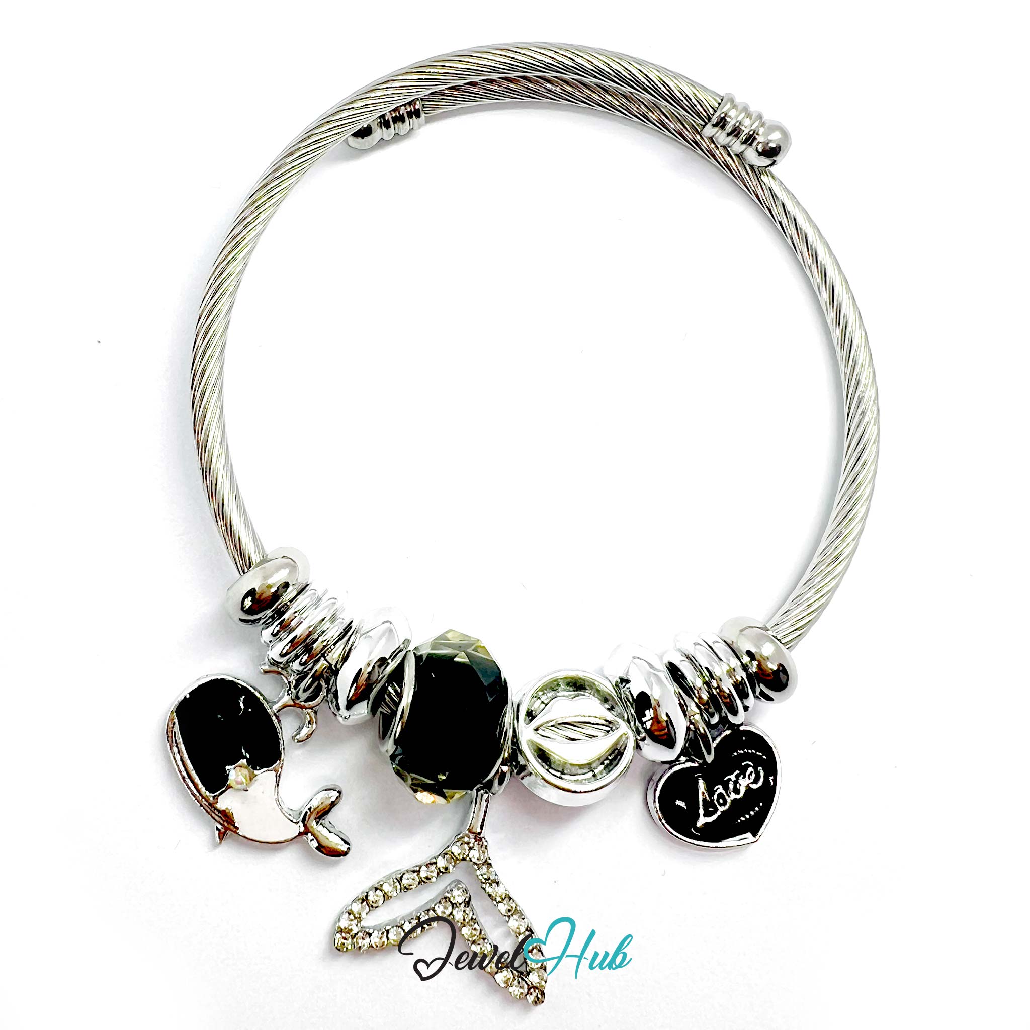 Silver bracelet with various charms on a white background