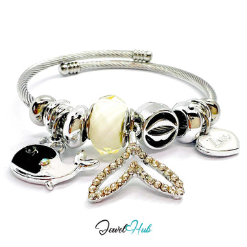 Silver bracelet with various charms on a white background, branded 'Jewel Hub'.
