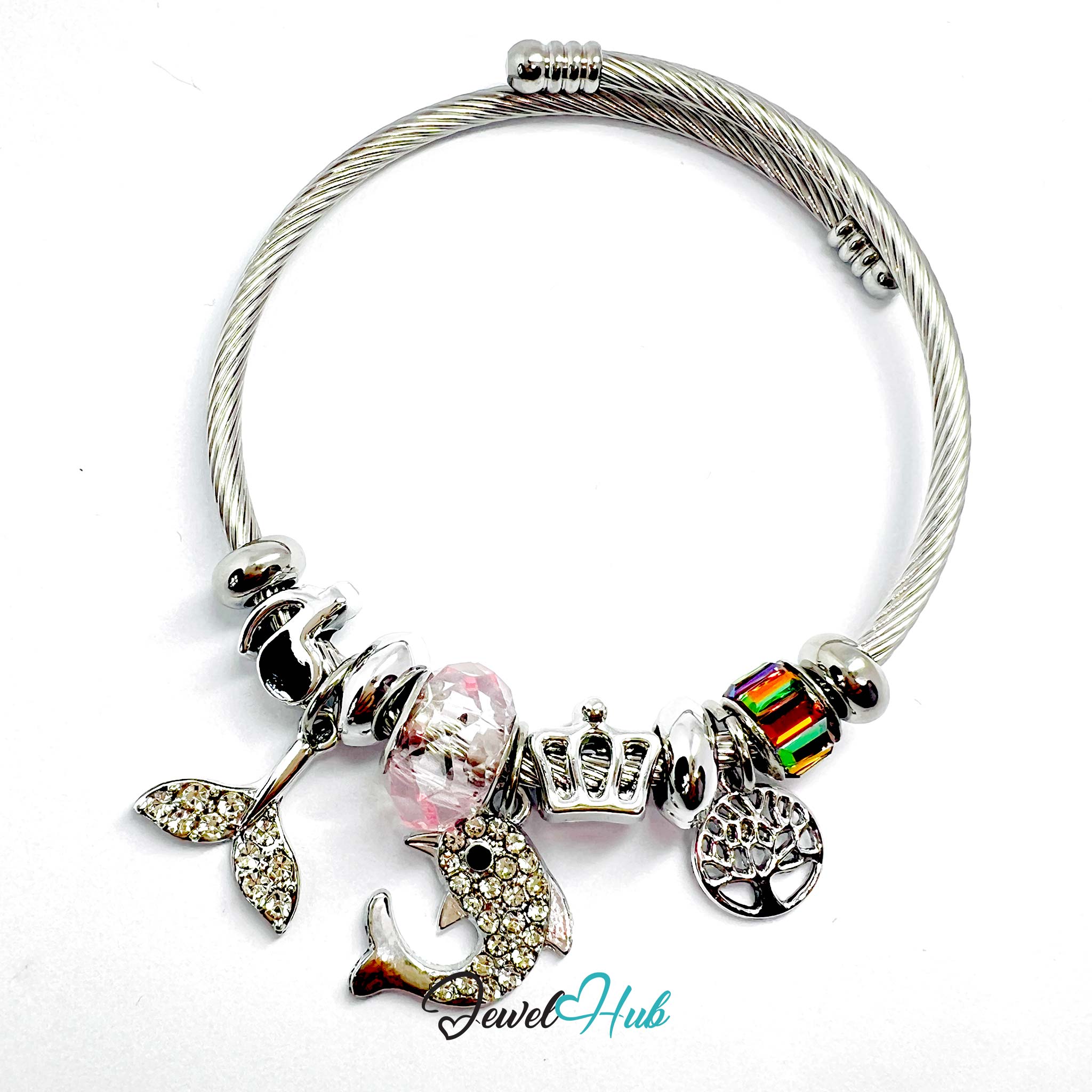 Silver bracelet with various charms on a white background