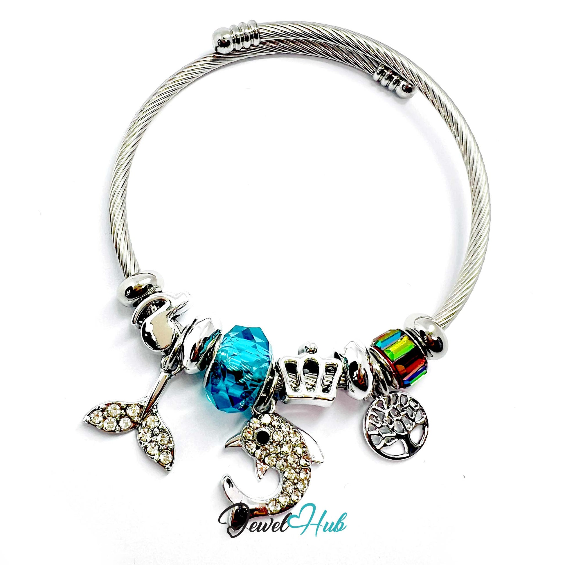 Silver bracelet with various charms including a blue bead and a dolphin charm on a white background.