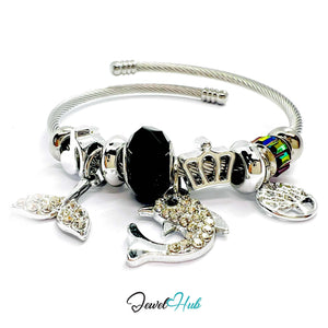 Silver bracelet with various charms on a white background, branded 'Jewel Hub'.