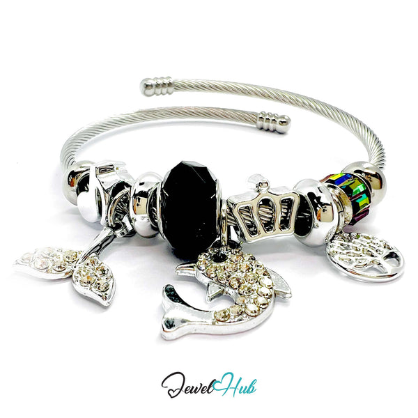 Silver bracelet with various charms on a white background, branded 'Jewel Hub'.