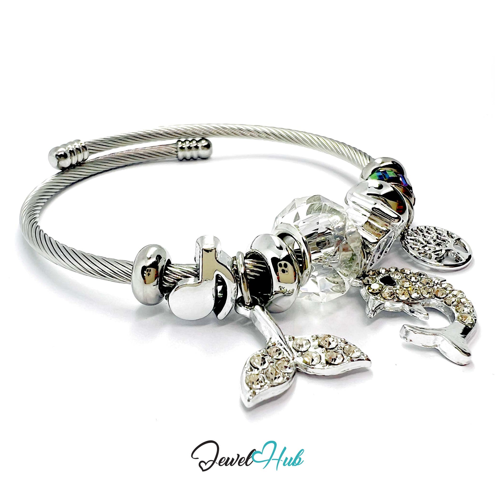 Silver bracelet with various charms on a white background, branded 'Jewel Hub'.