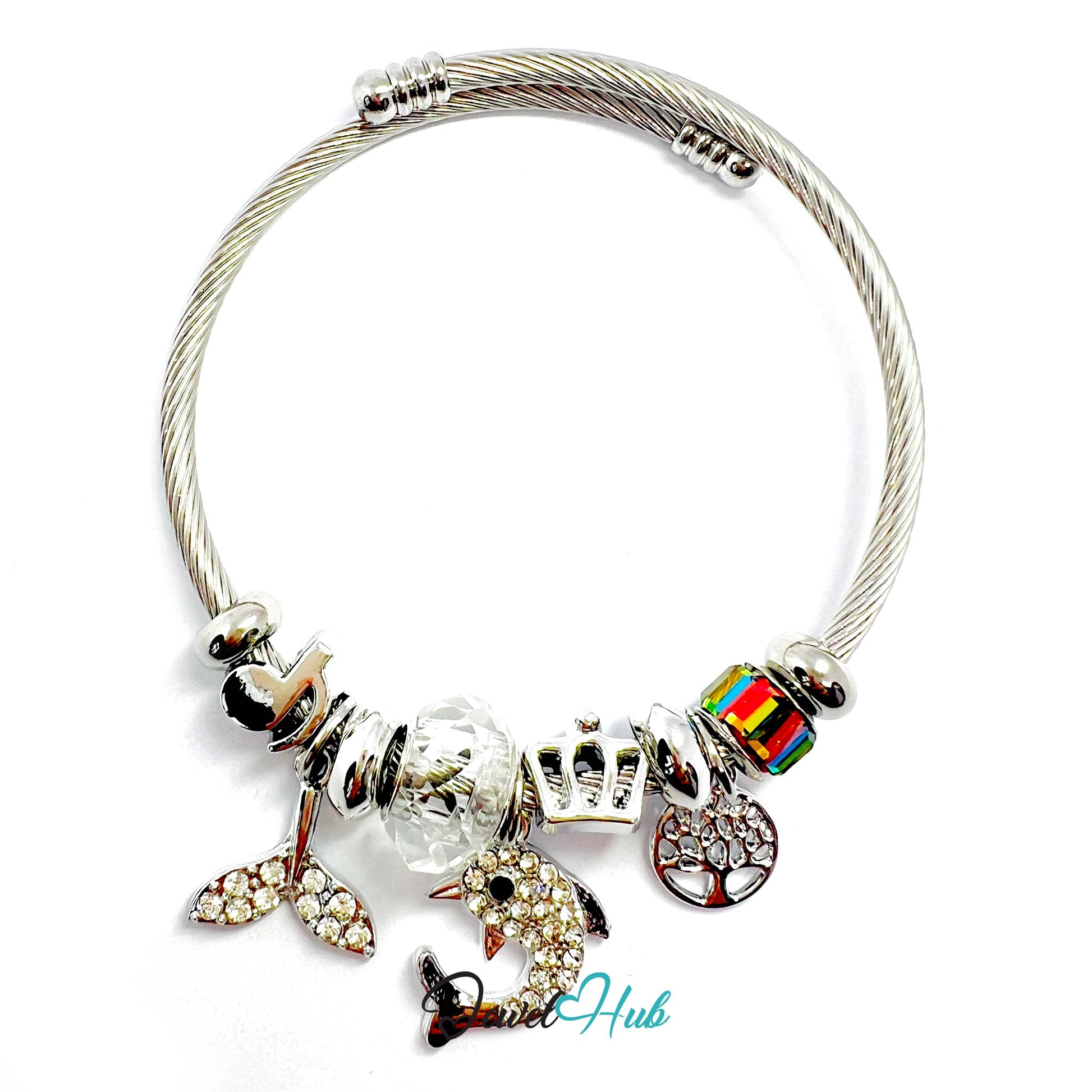 Charm bracelet with various charms on a white background