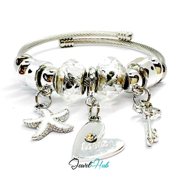 Silver bracelet with various charms on a white background, branded 'Jewel Hub'.