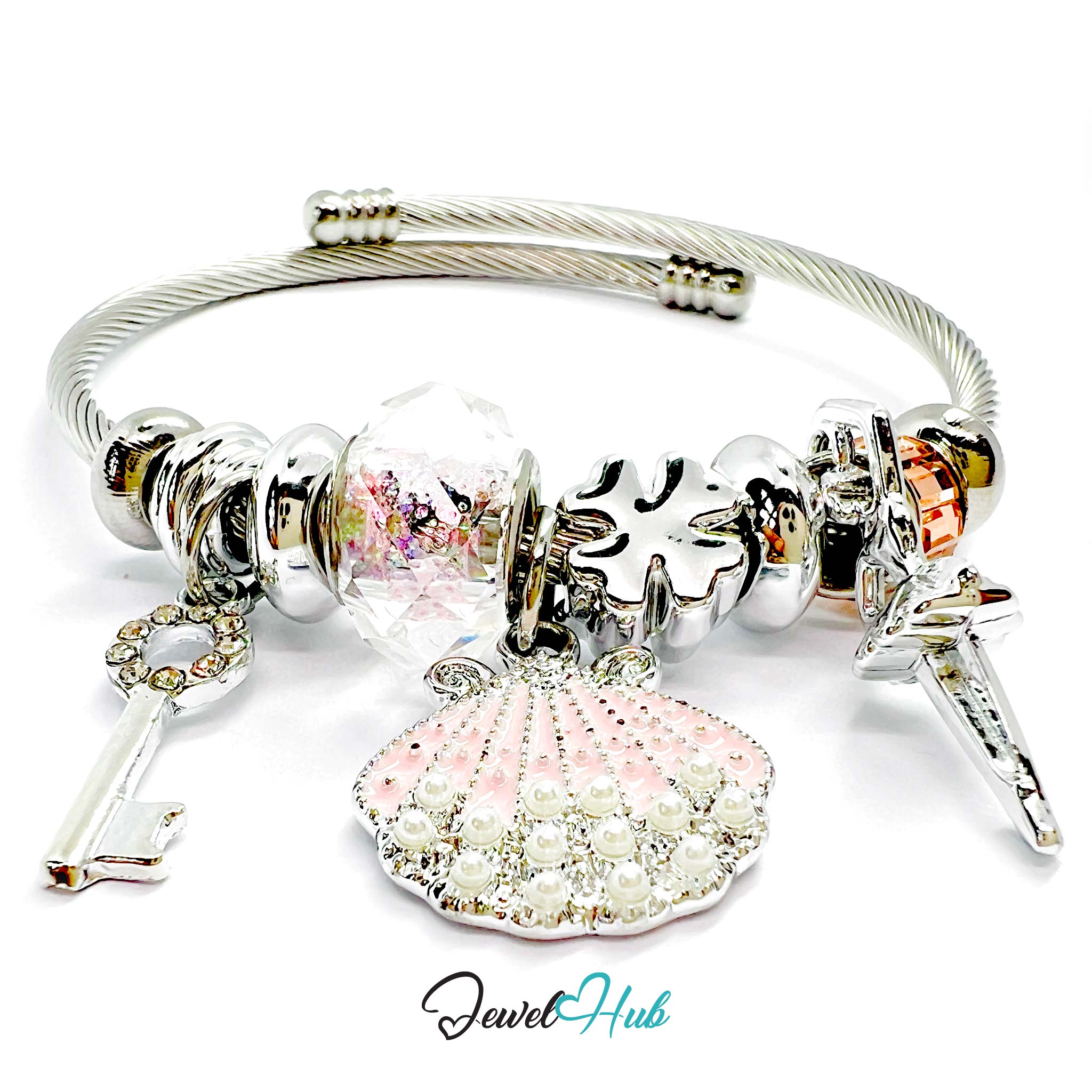 Silver bracelet with various charms including a shell, key, and sword on a white background.