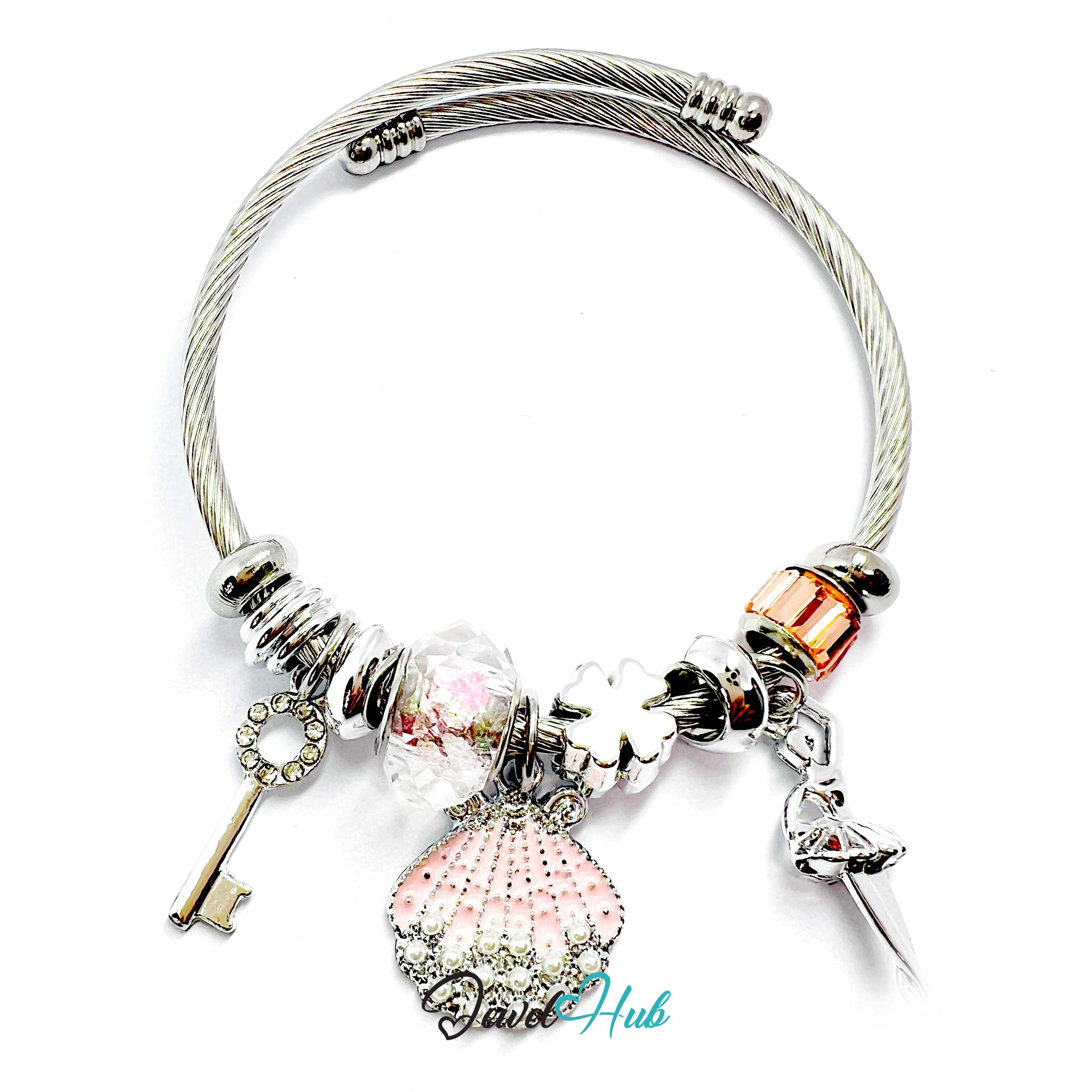 Silver bracelet with various charms on a white background