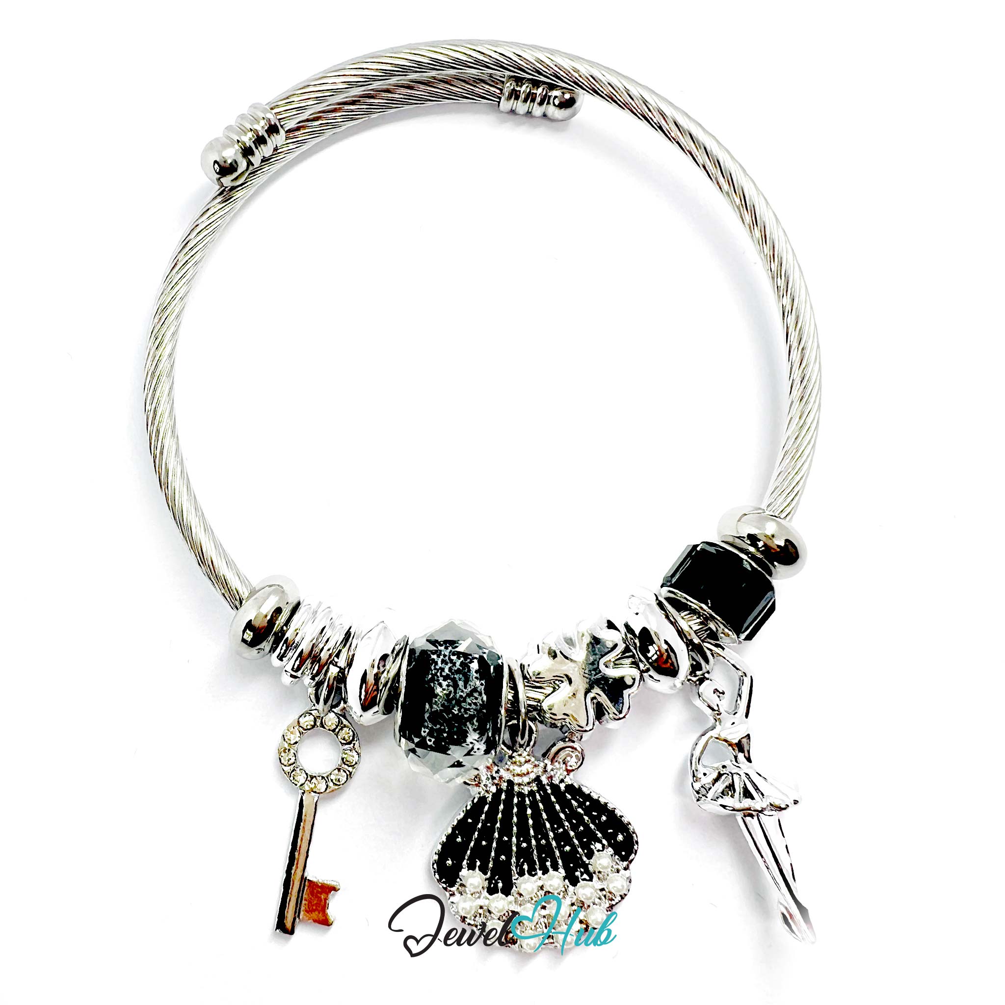 Silver bracelet with various charms on a white background
