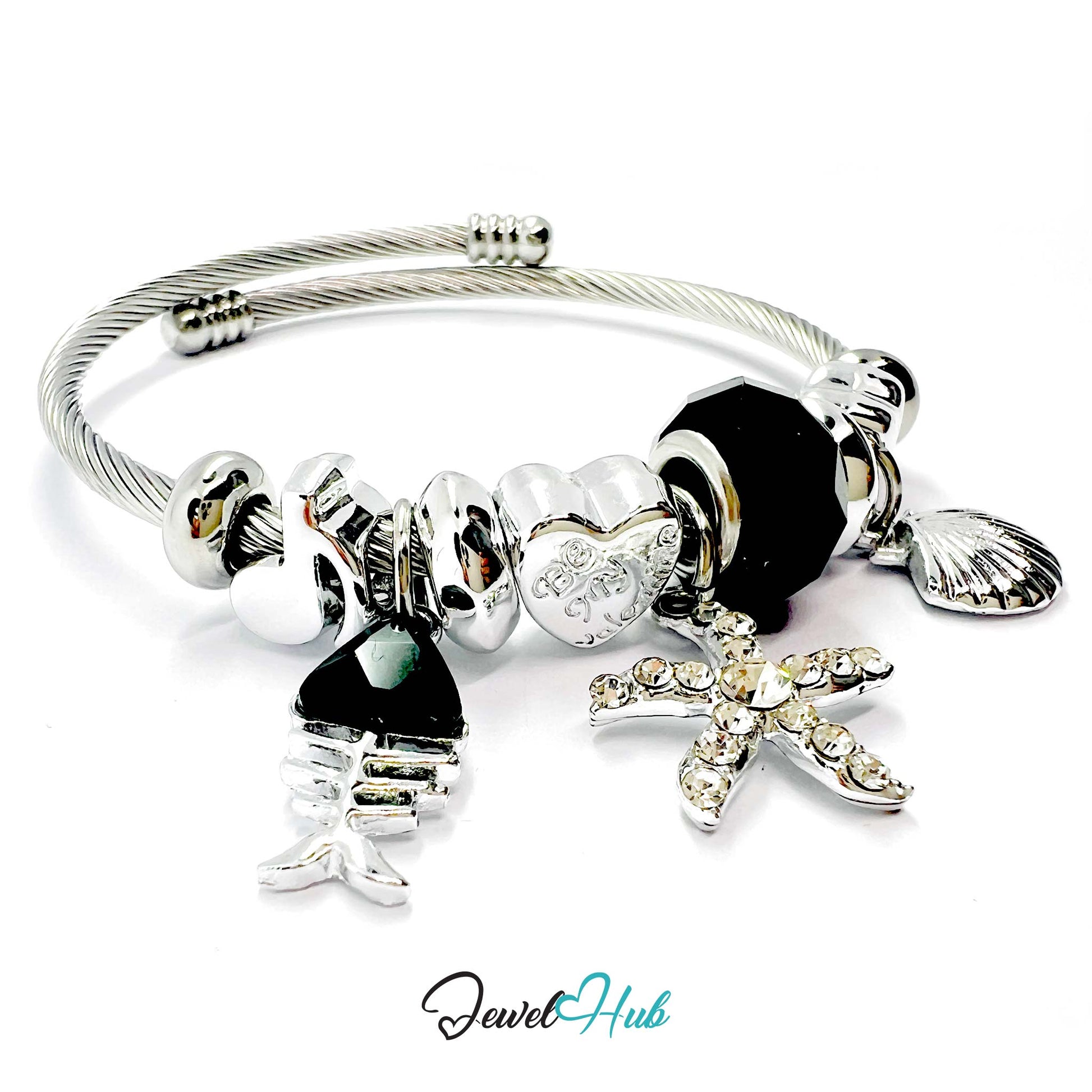 Silver stainless steel bracelet with various charms on a white background