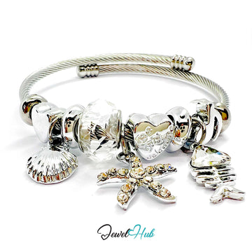 Silver stainless steel bracelet with various charms on a white background