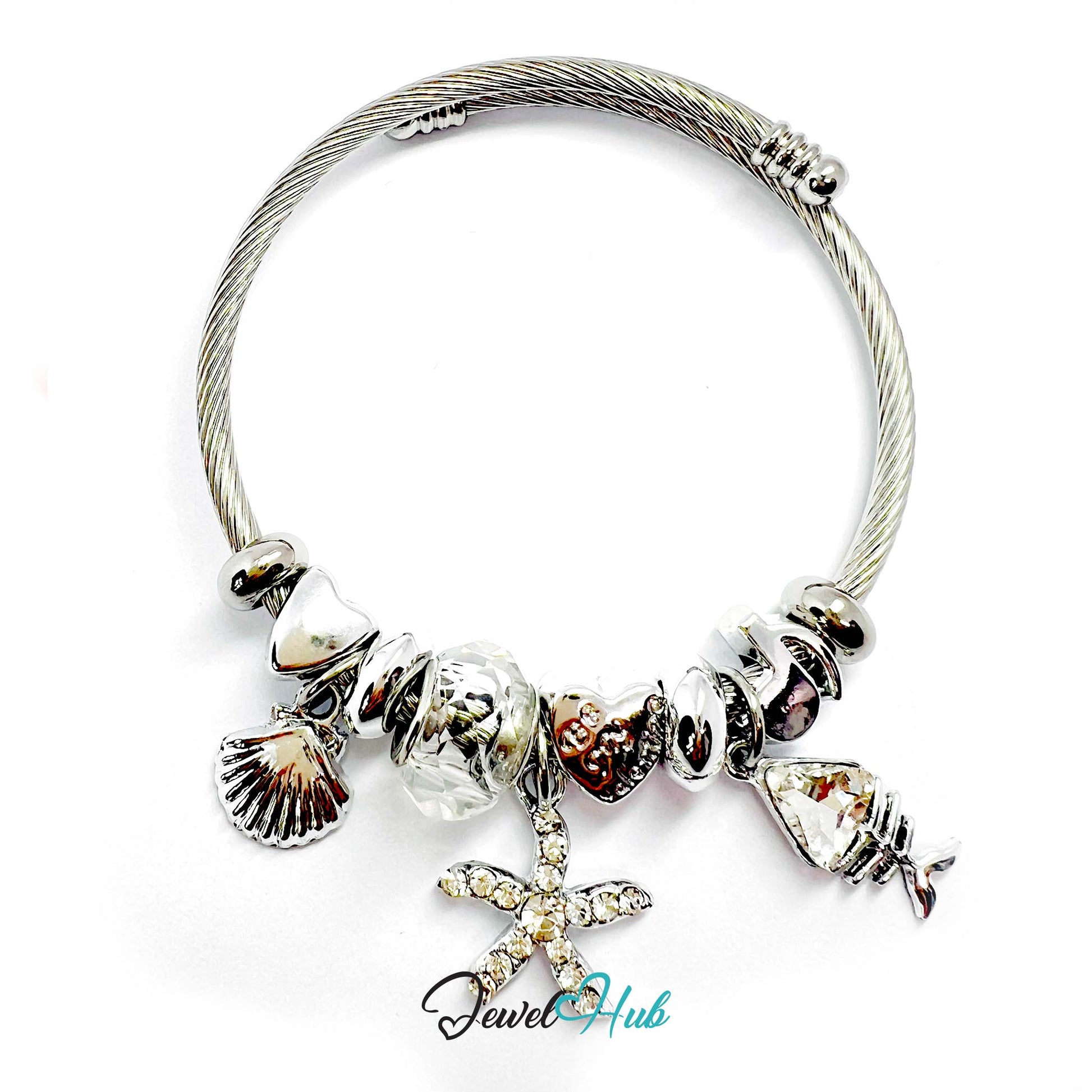 Silver bracelet with various charms on a white background