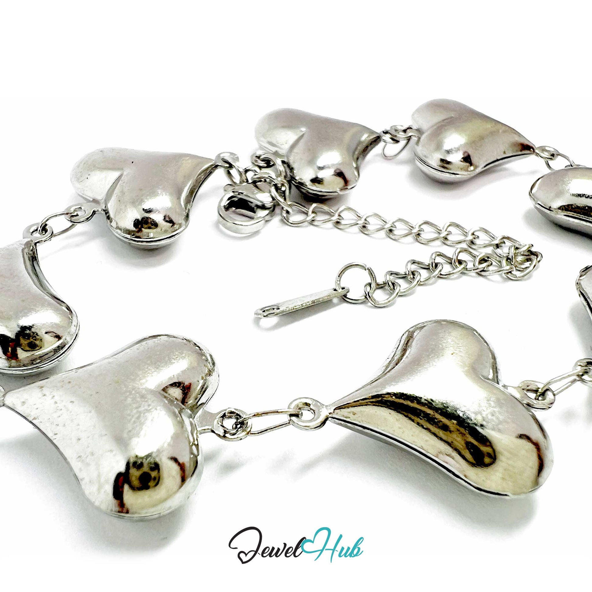 Silver heart-shaped bracelet on a white background with 'Jewel Hub' branding.