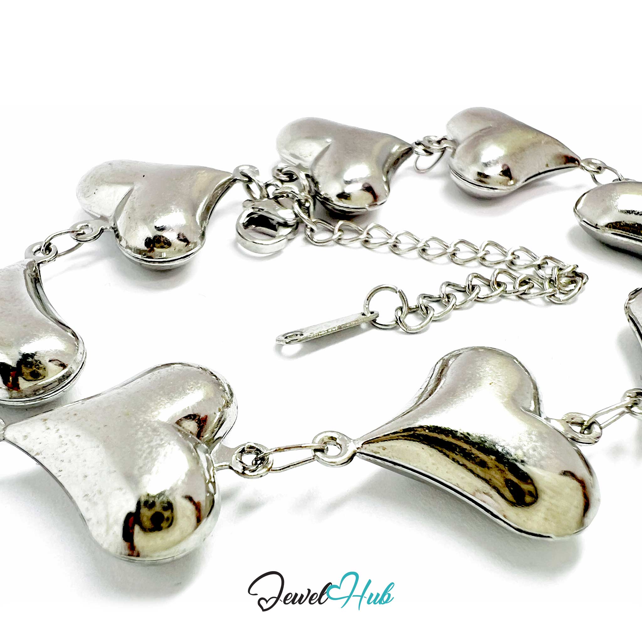 Silver heart-shaped bracelet on a white background with 'Jewel Hub' branding.