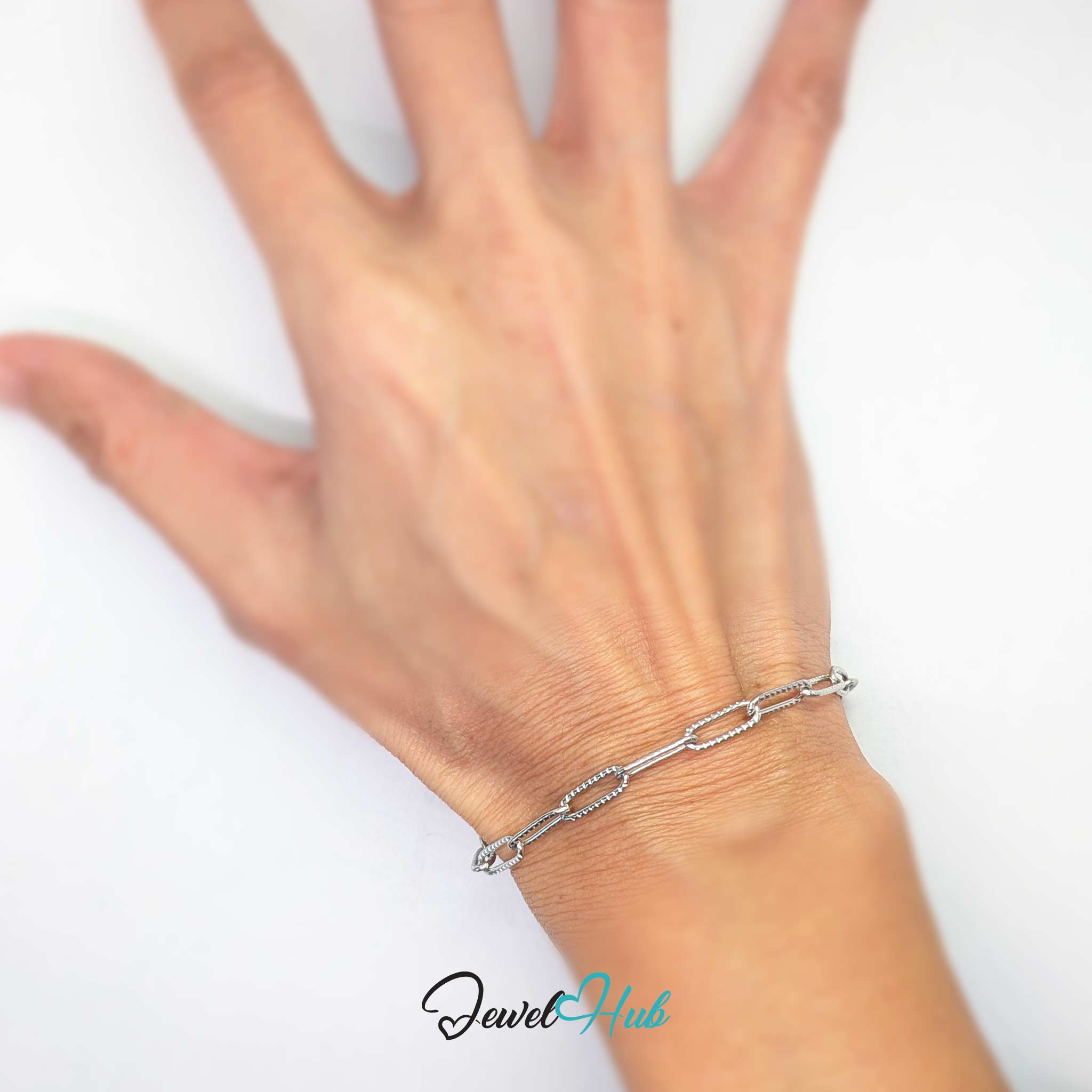 A silver stainless steel paperclip chain bracelet with a lobster clasp, displayed on a clean white background 