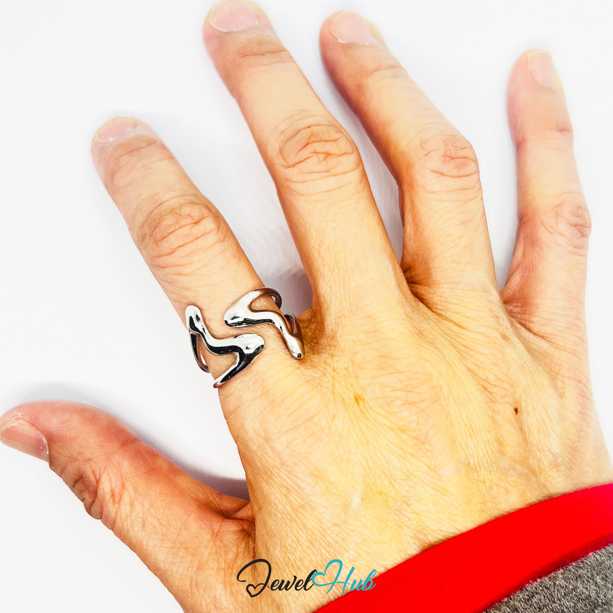 Hand wearing a silver ring with a white background