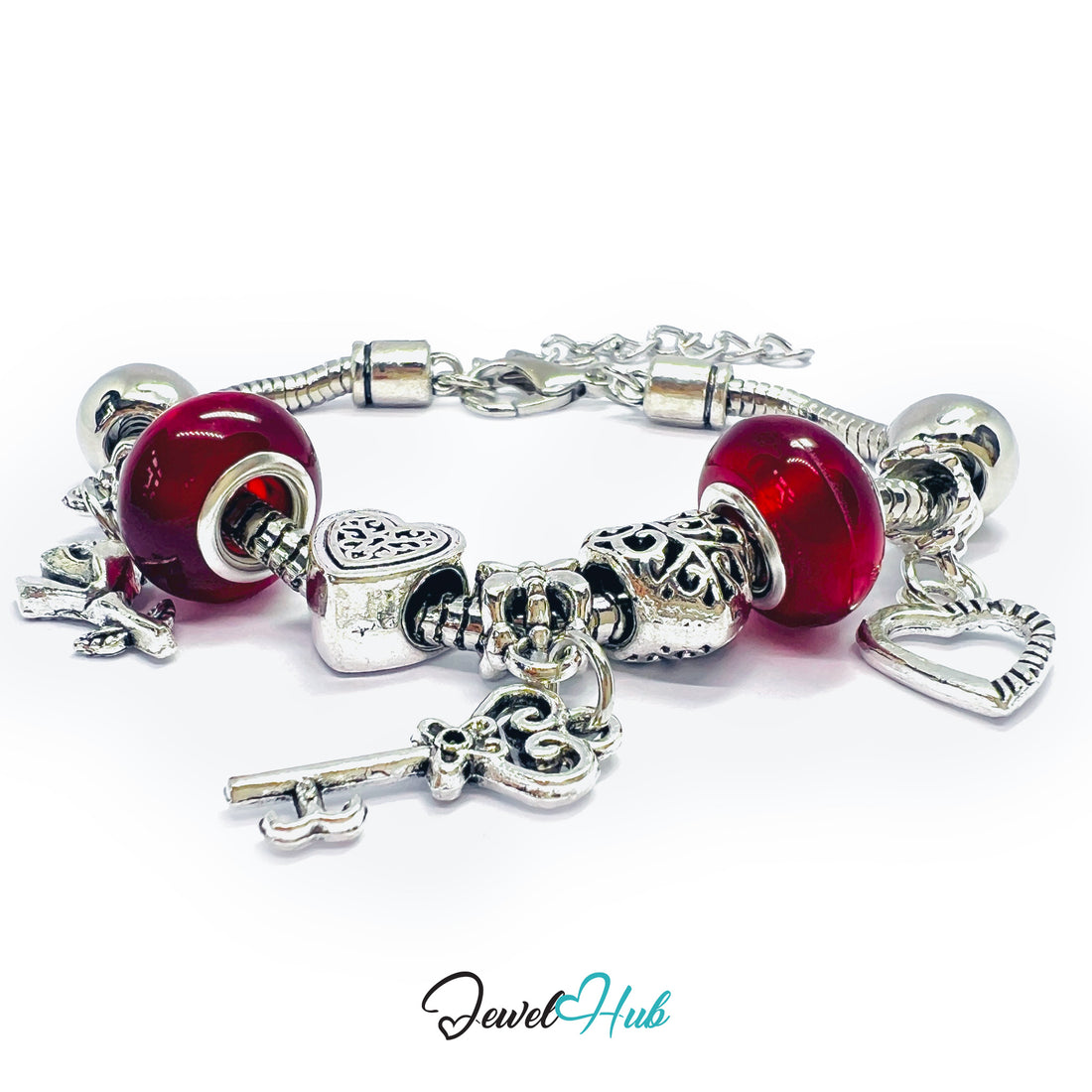 Silver charm bracelet with red beads on a white background, branded 'Jewel Hub'.