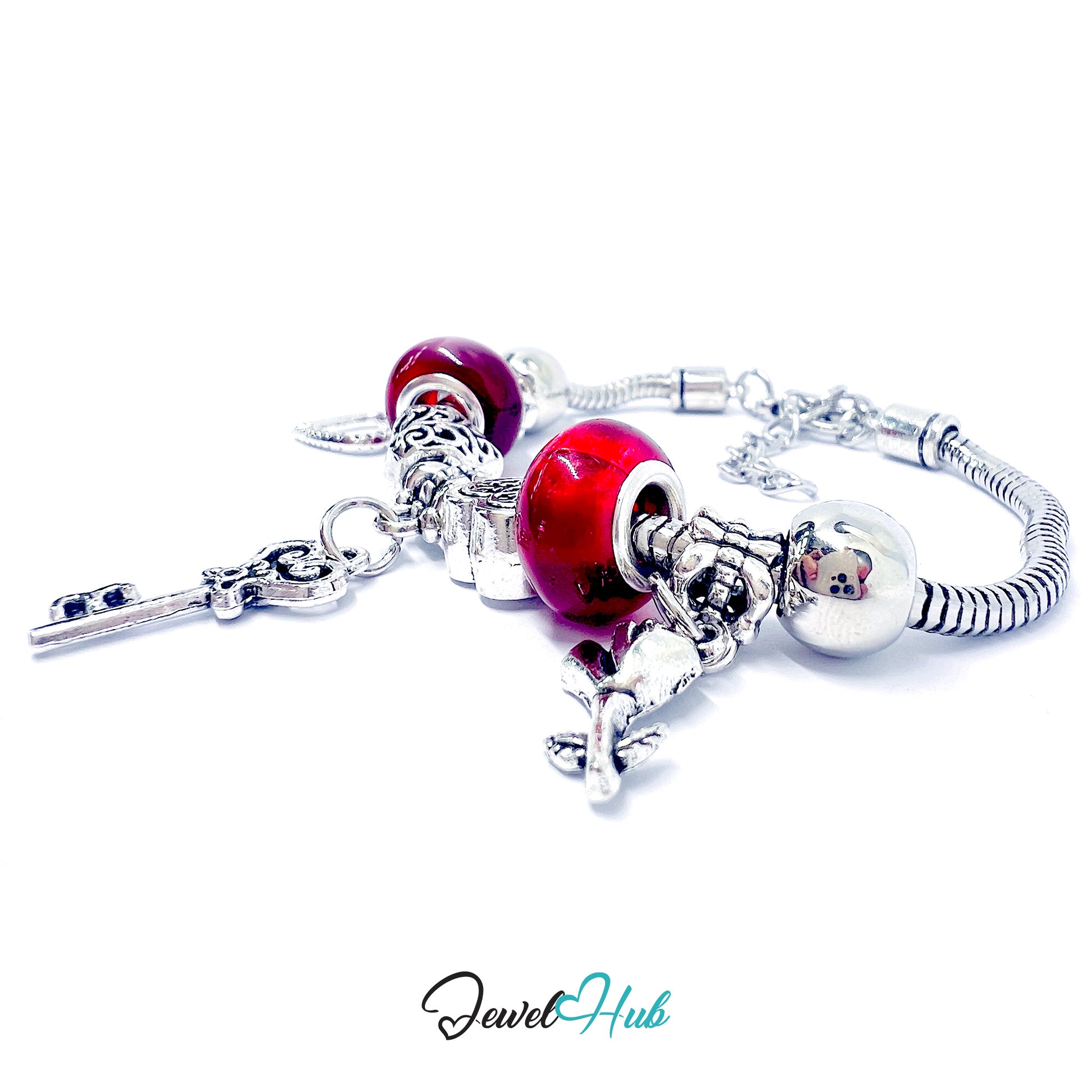 Silver bracelet with red heart-shaped charms on a white background, branded 'Jewel Hub'.