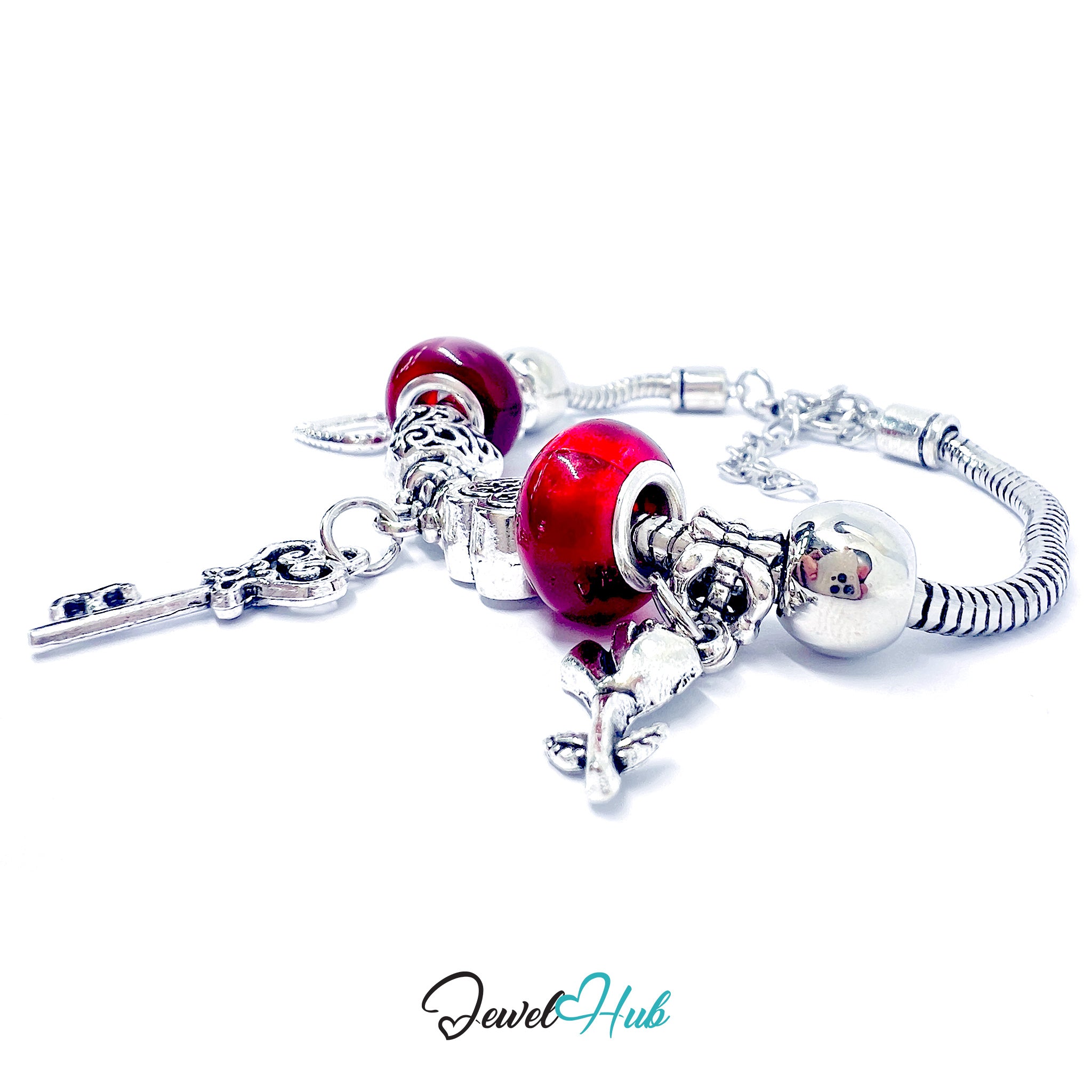 Silver bracelet with red heart-shaped charms on a white background, branded 'Jewel Hub'.