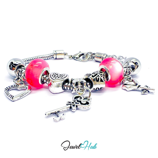 Silver bracelet with pink beads and charms on a white background, branded 'Jewel Hub'.
