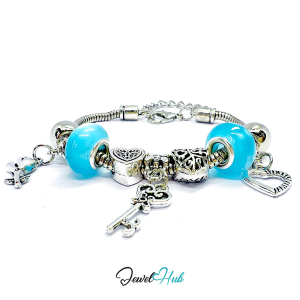 Bracelet with blue beads and silver charms on a white background, branded 'Jewel Hub'.