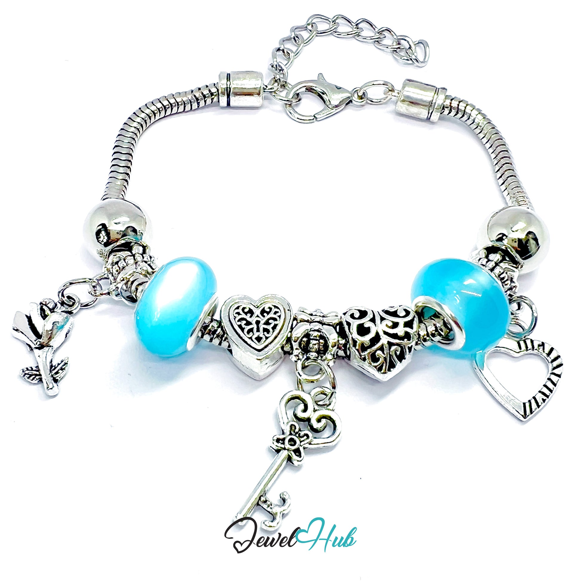 Silver bracelet with blue beads and charms on a white background, branded 'Jewel Hub'.