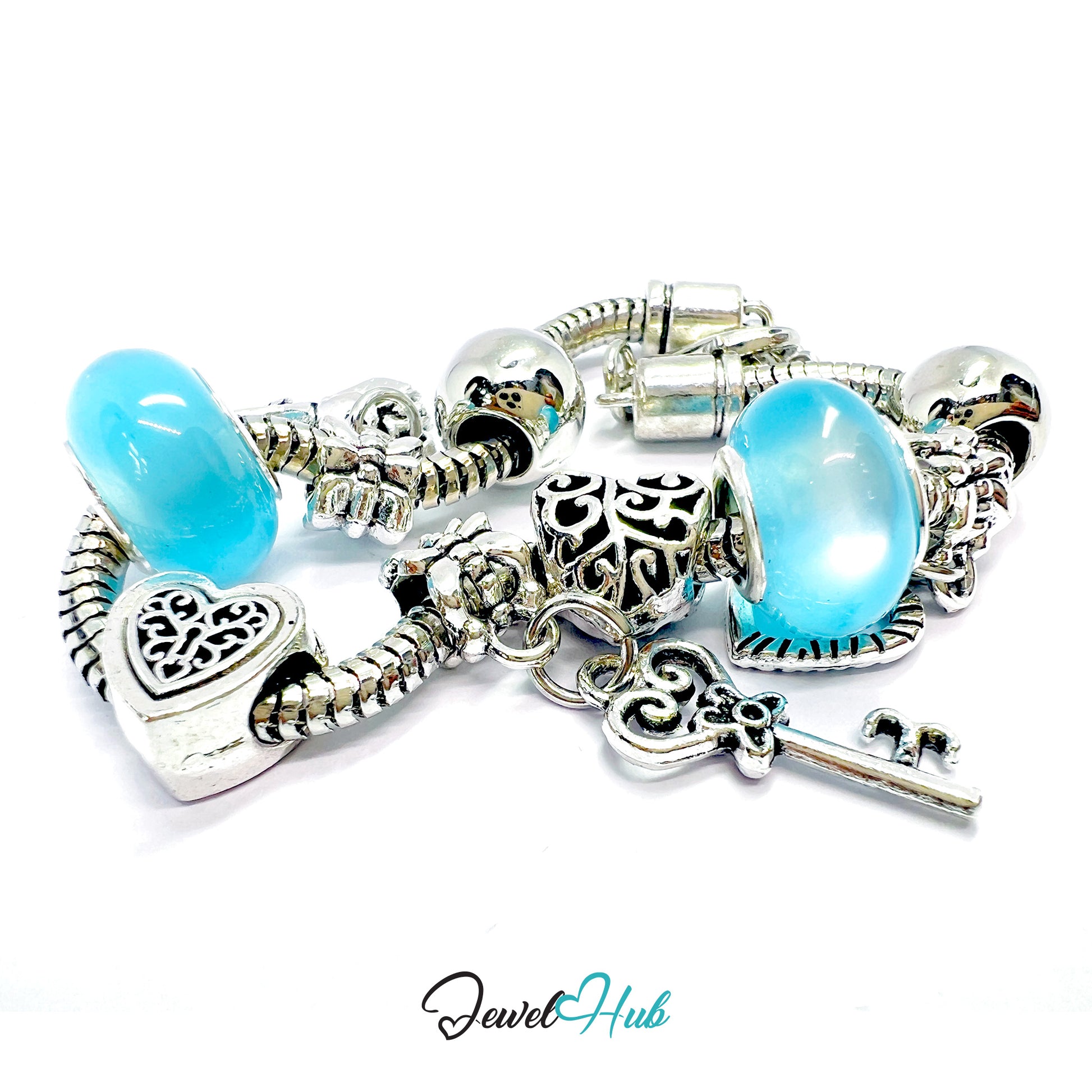 Silver charm bracelet with blue heart-shaped beads on a white background, branded 'Jewel Hub'.