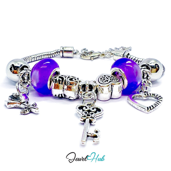 Silver charm bracelet with purple beads on a white background, branded 'Jewel Hub'.