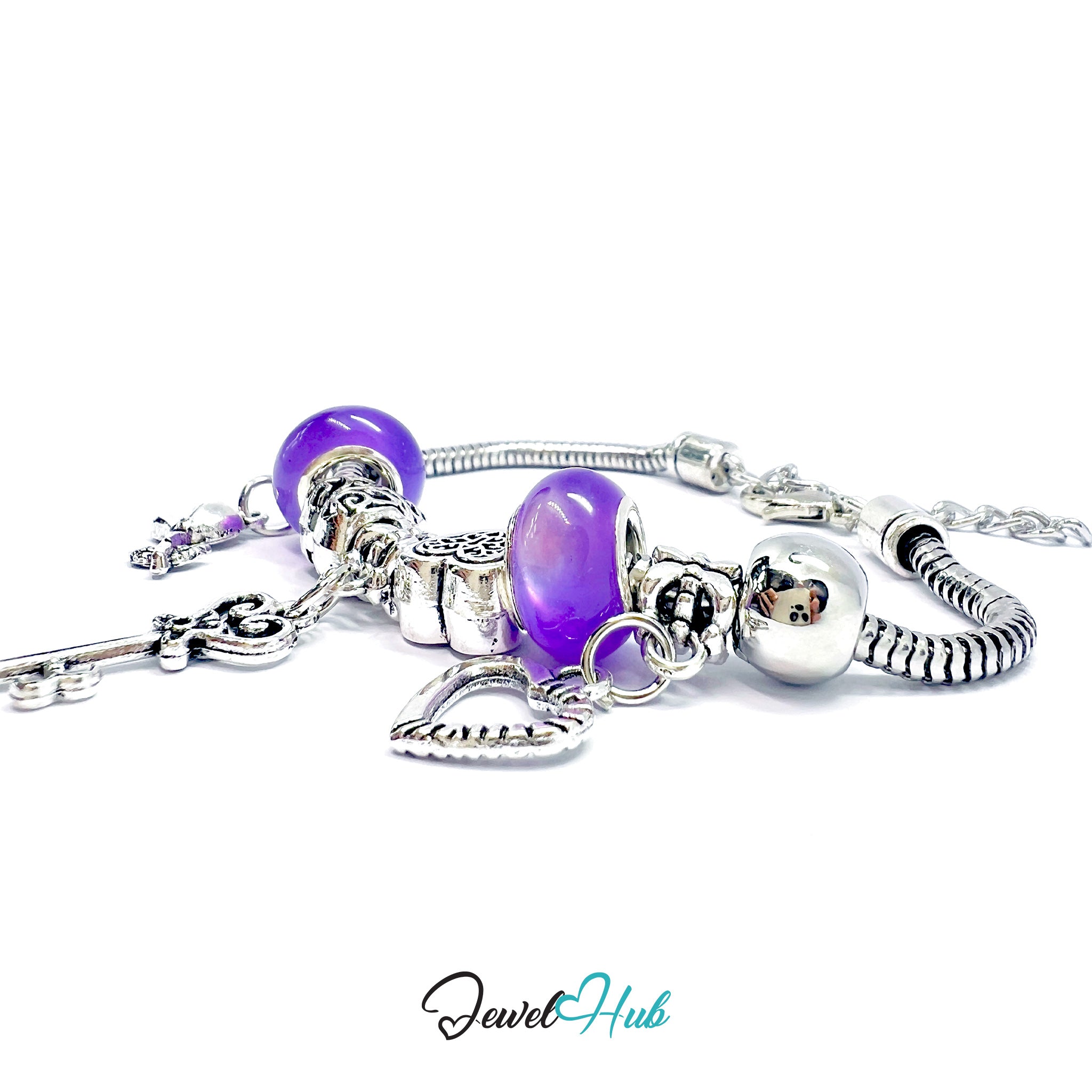 Silver bracelet with purple beads on a white background, branded 'Jewel Hub'.