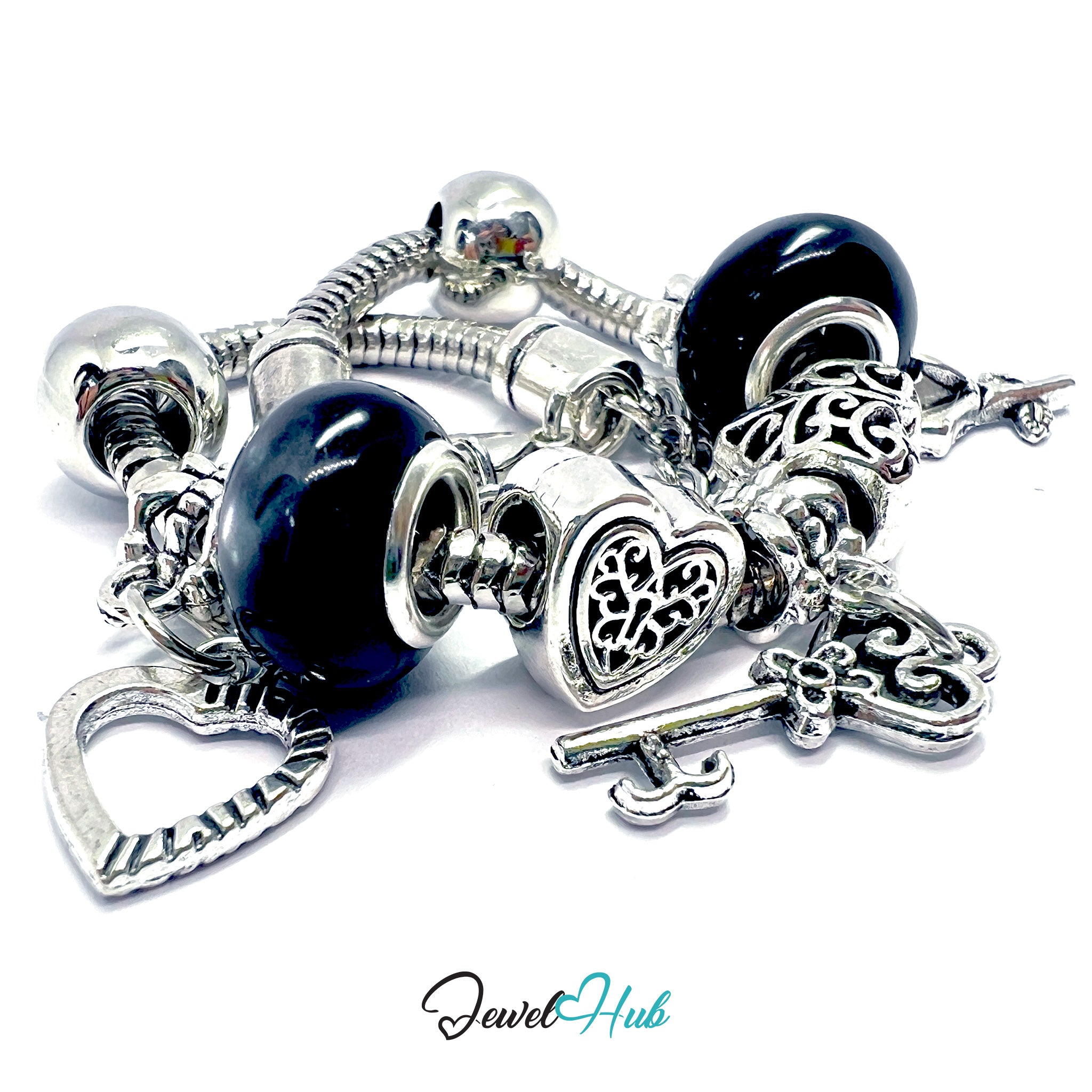 Silver charm bracelet with blue beads and various charms on a white background, branded 'Jewel Hub'.