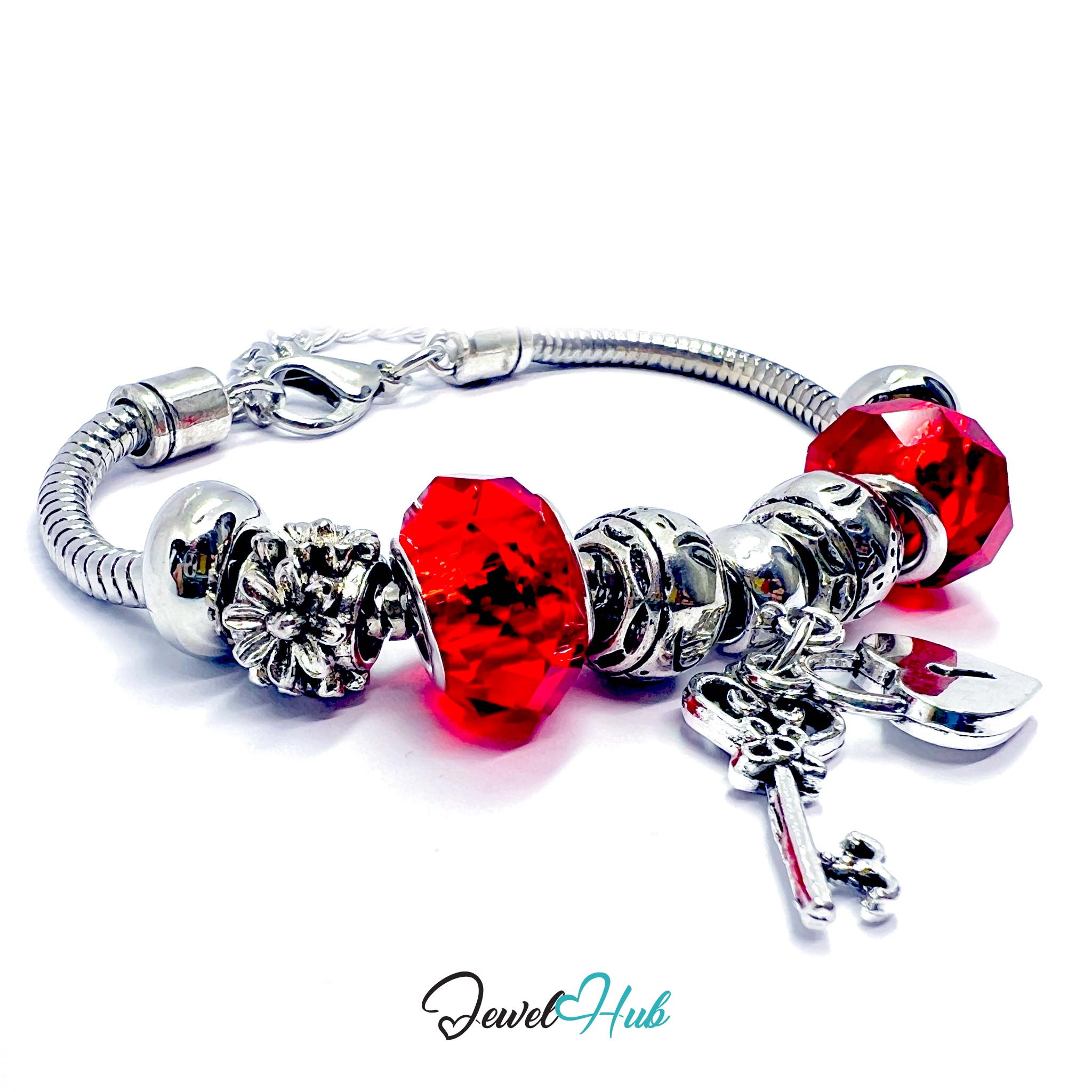 Silver bracelet with red beads and a key charm on a white background, branded 'Jewel Hub'.