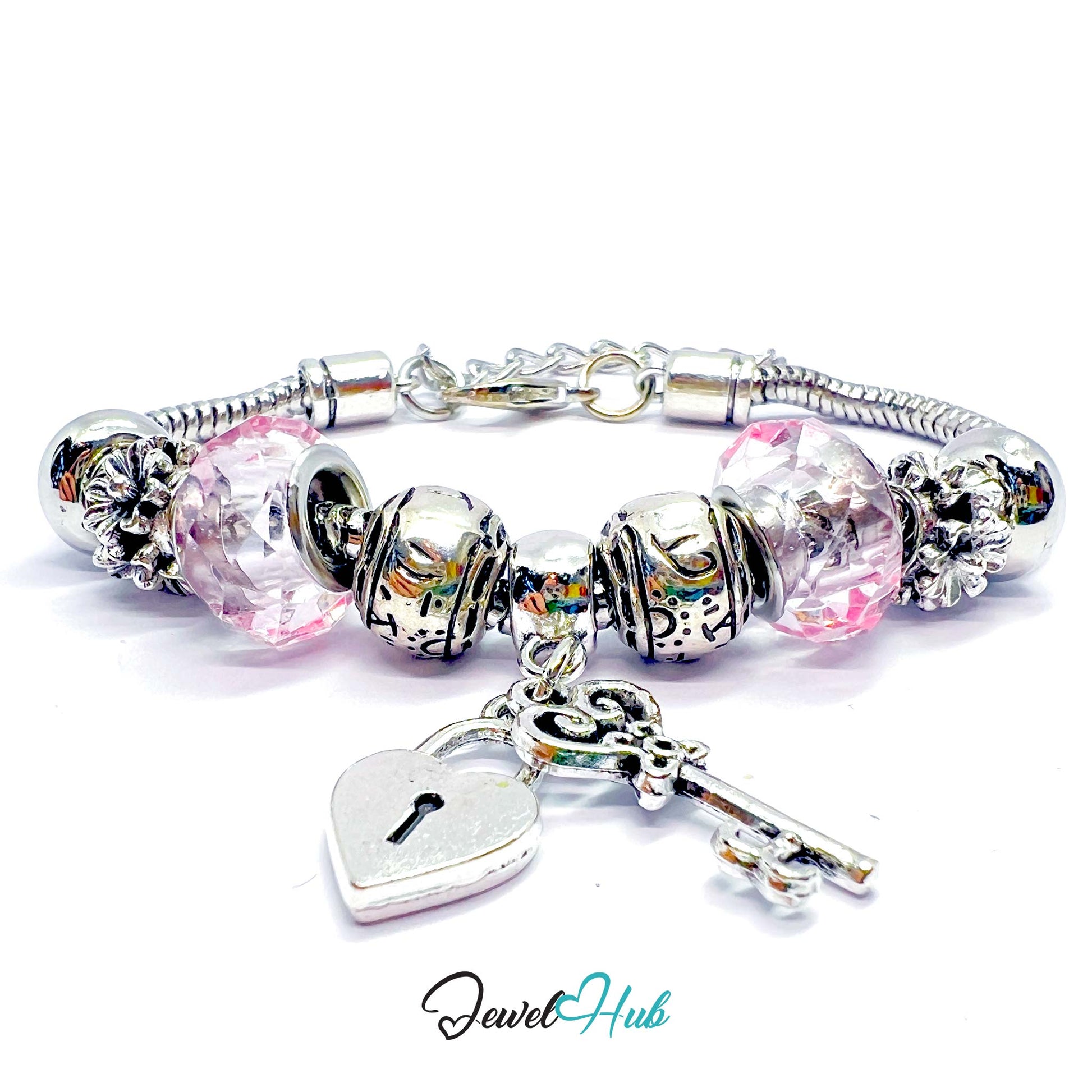 Silver bracelet with pink beads and charms on a white background, branded 'Jewel Hub'.