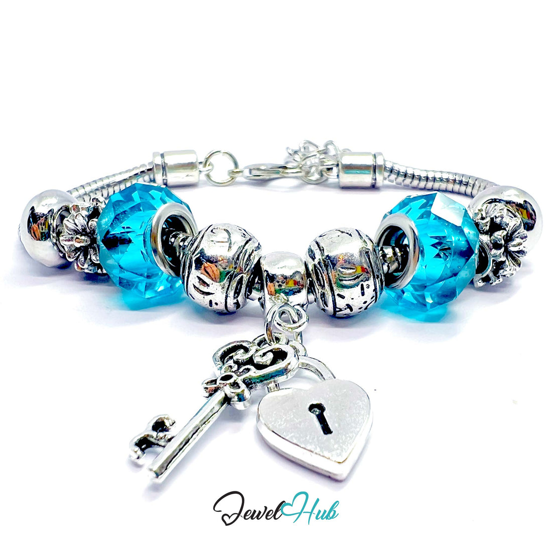 Silver bracelet with blue beads and key and heart charms on a white background, branded 'Jewel Hub'.