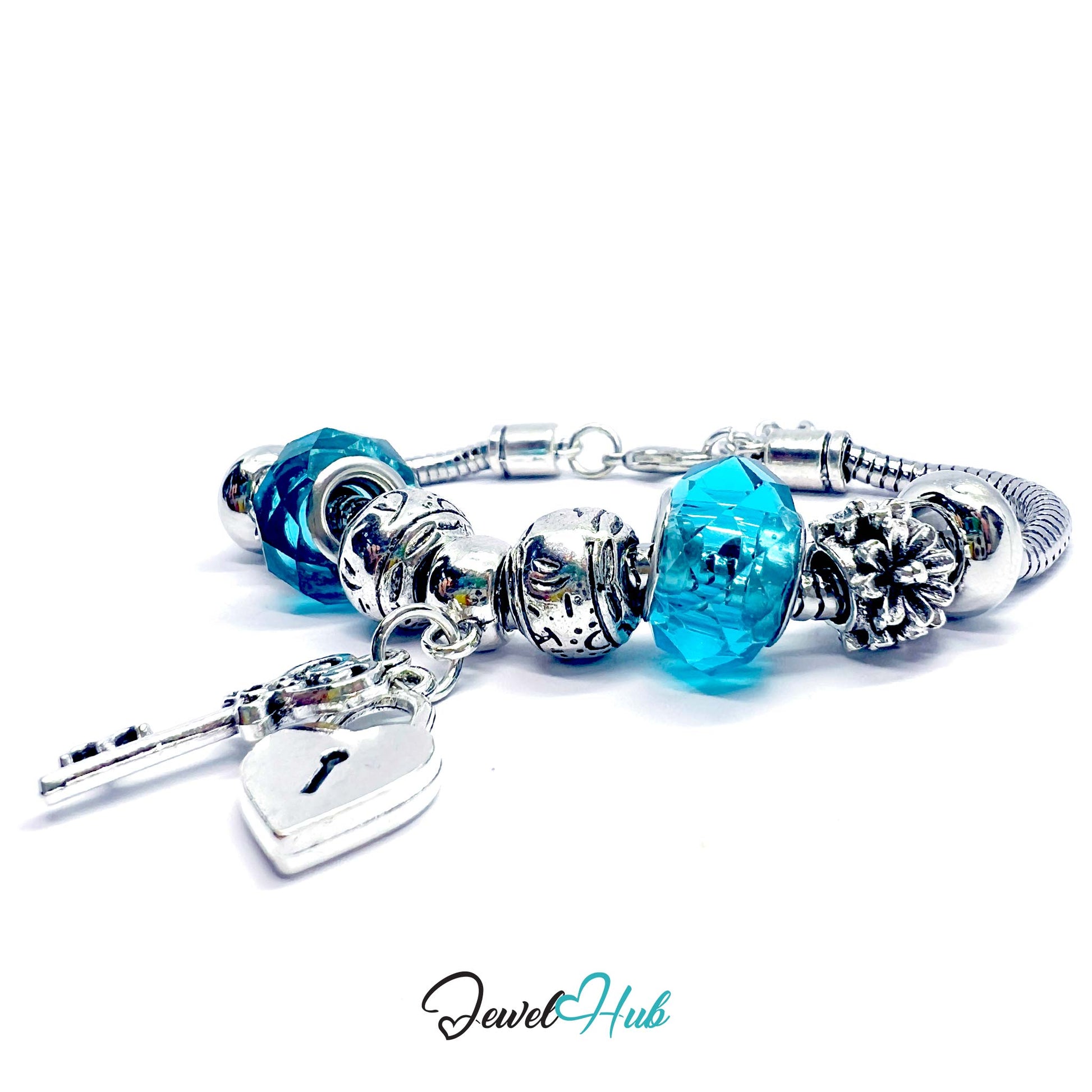 Silver bracelet with blue beads and charms on a white background, branded 'Jewel Hub'.
