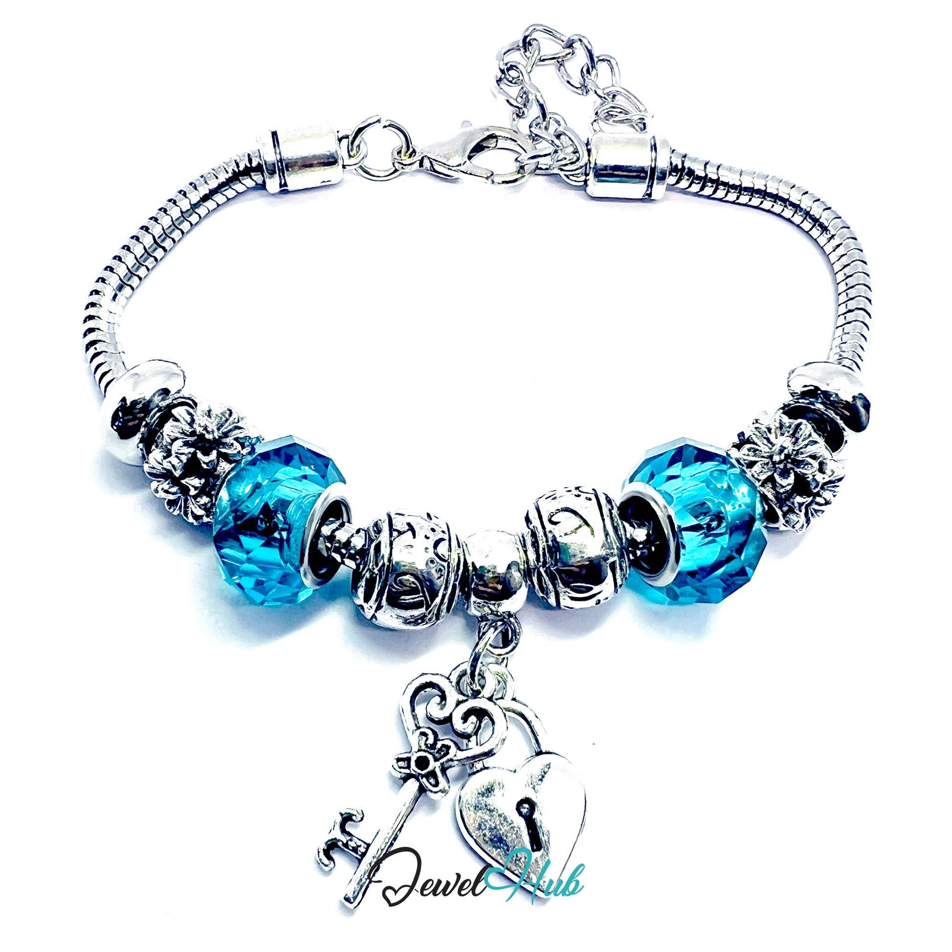 Silver bracelet with blue beads and charms on a white background