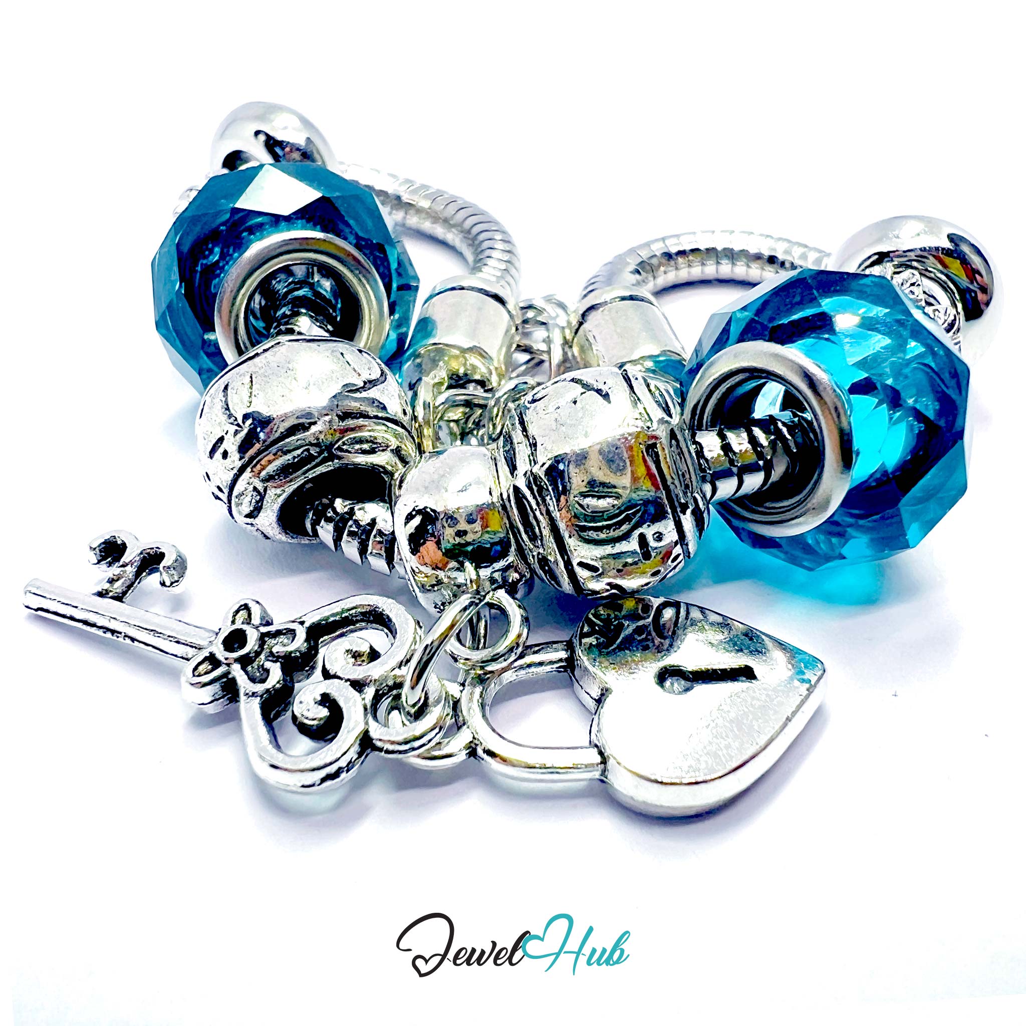 Silver and blue beaded charm bracelet on a white background with 'Jewel Hub' branding.
