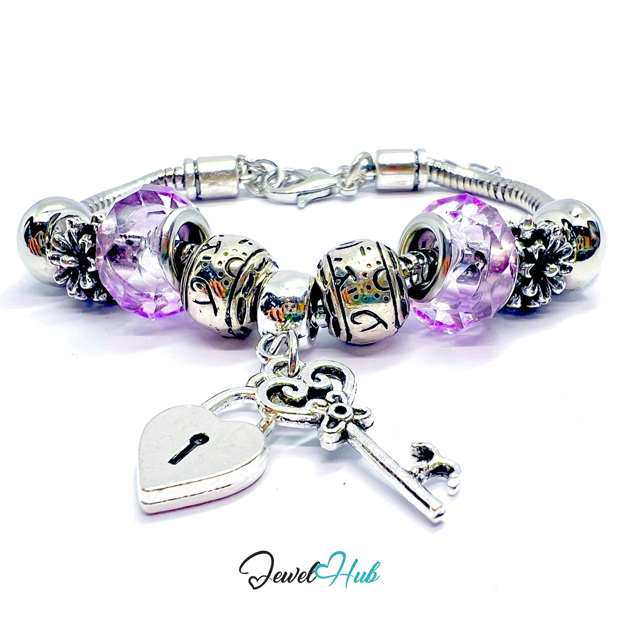 Silver bracelet with purple beads and charms on a white background, branded 'Jewel Hub'.