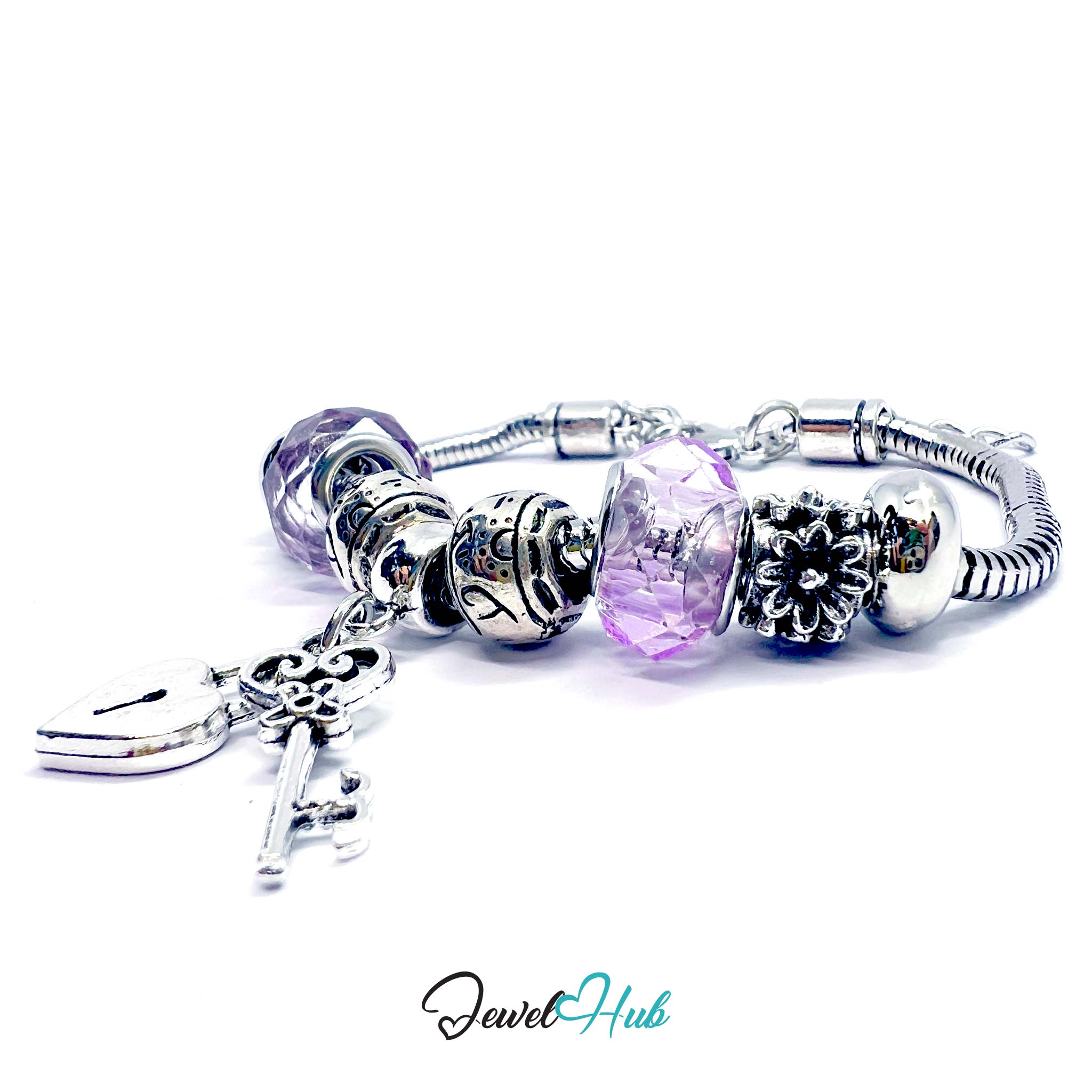 Silver bracelet with various charms on a white background, branded 'Jewel Hub'.