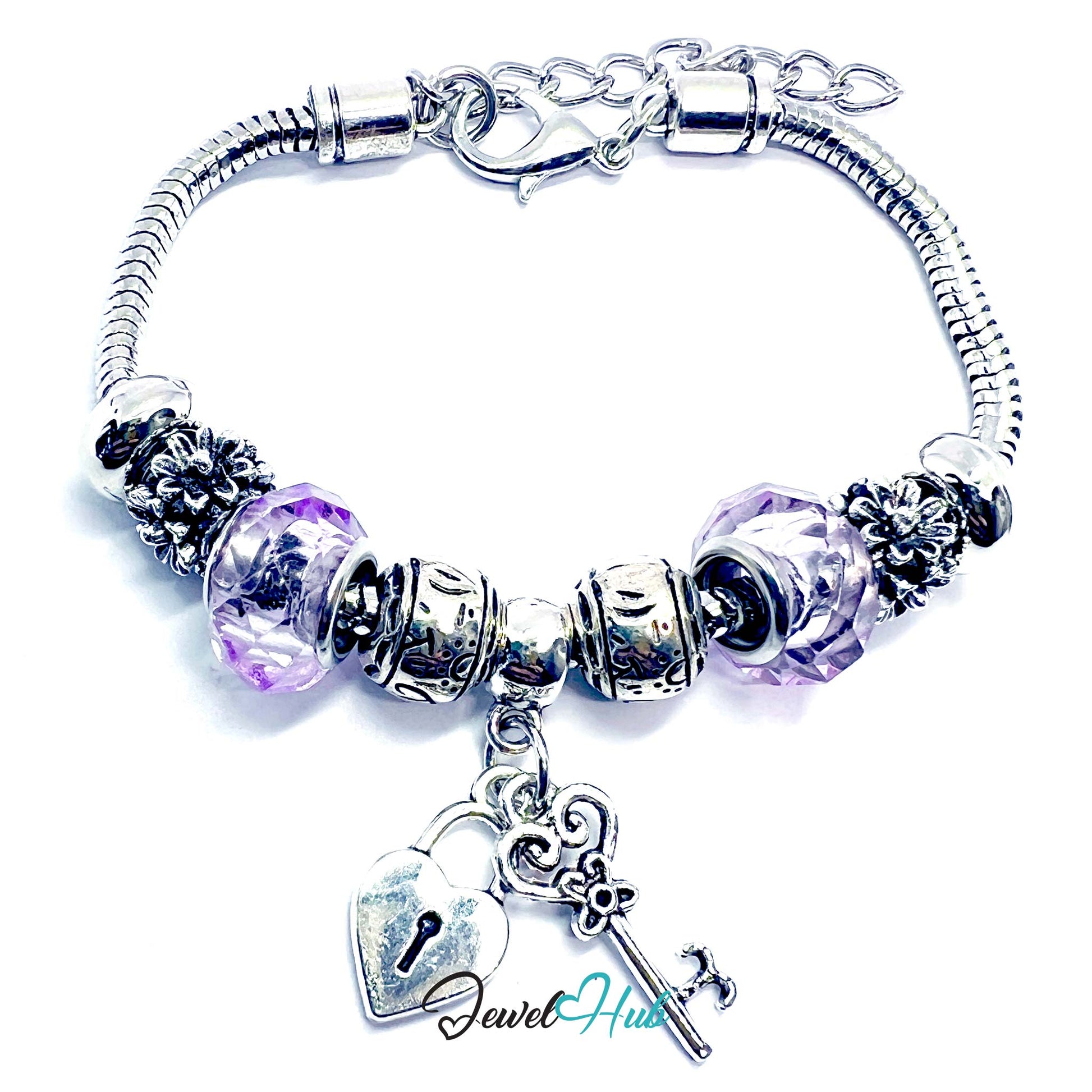 Silver bracelet with purple beads and a heart-shaped lock charm on a white background
