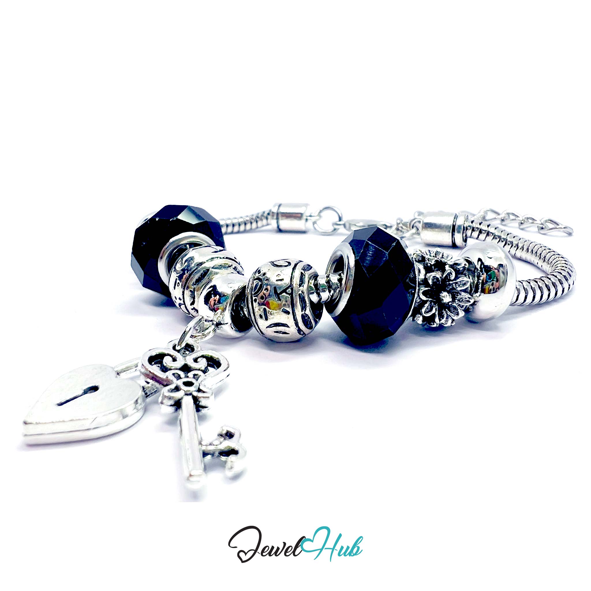 Silver bracelet with blue beads and charms on a white background, branded 'Jewel Hub'.