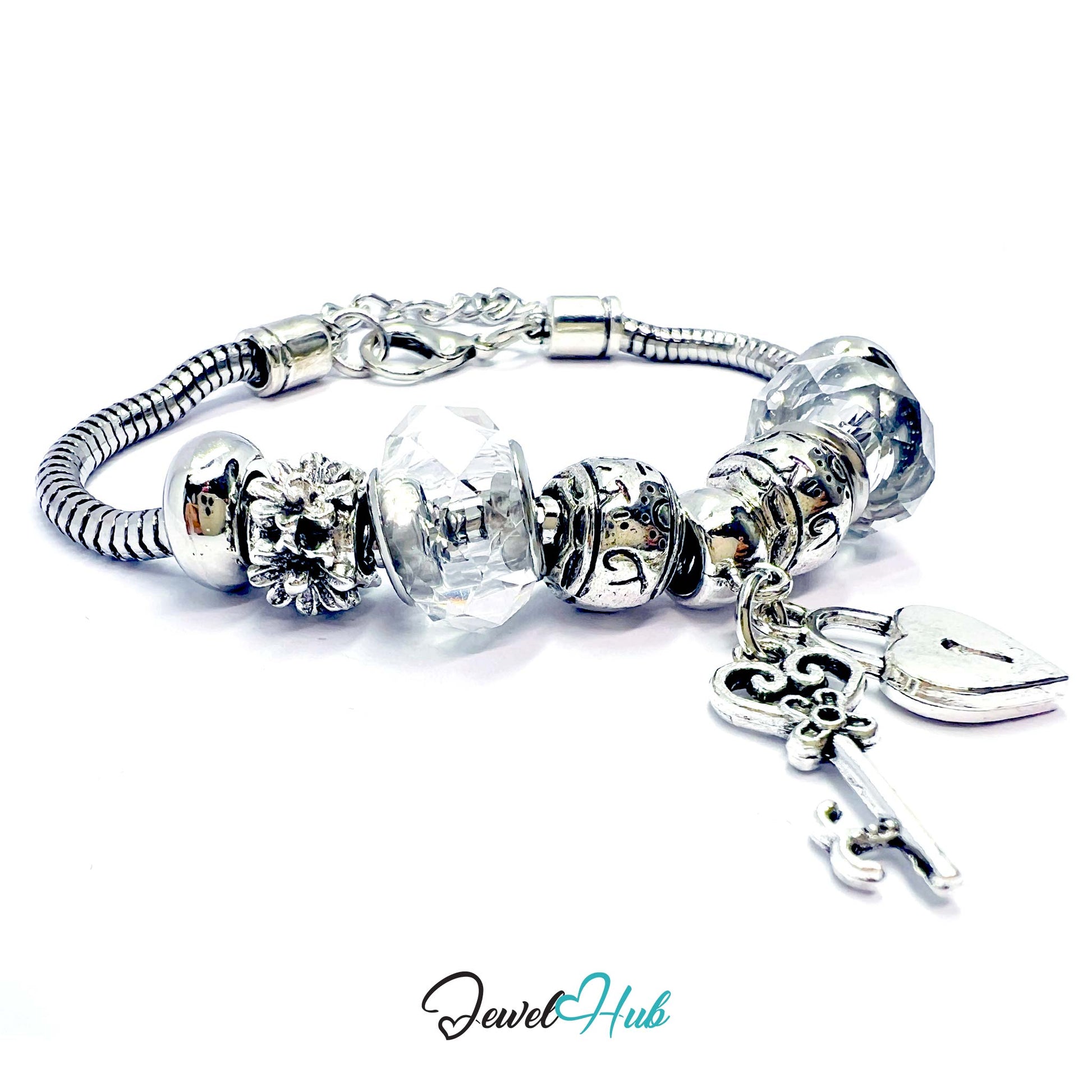 Silver bracelet with clear beads and a key charm on a white background, branded 'Jewel Hub'.