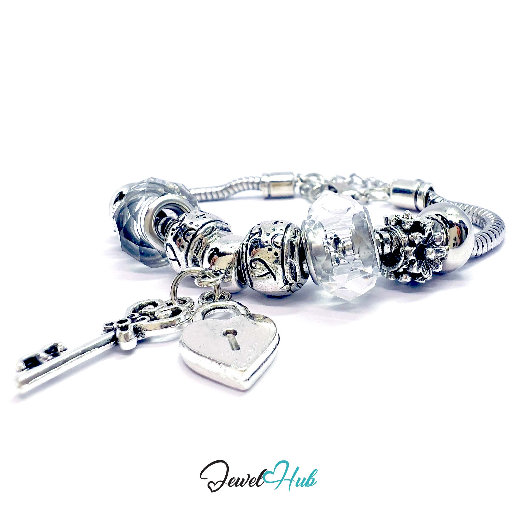 Silver charm bracelet with heart-shaped lock charm on a white background, branded 'Jewel Hub'.