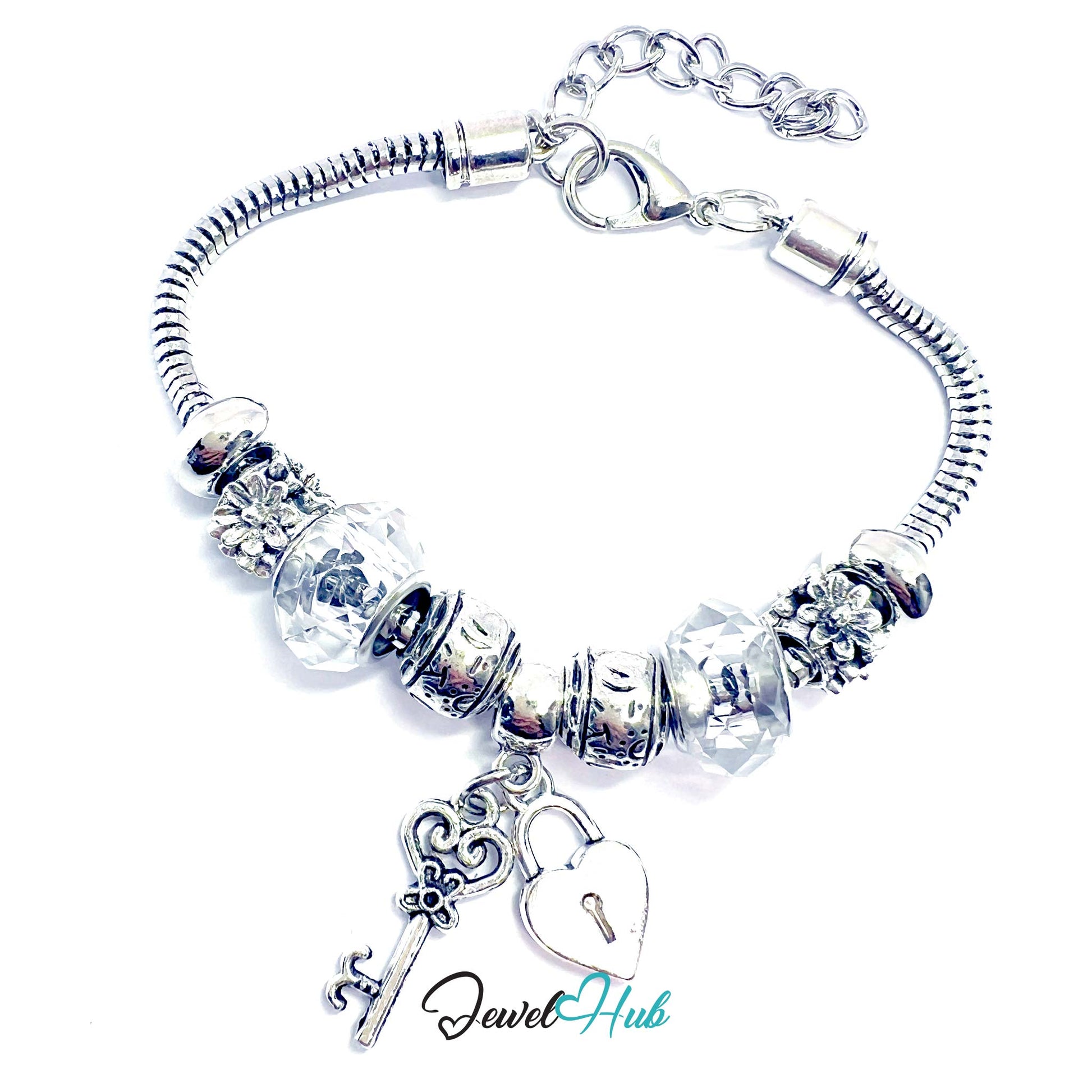 Silver bracelet with key and heart lock charm on a white background, brand 'Jewel Hub' visible.