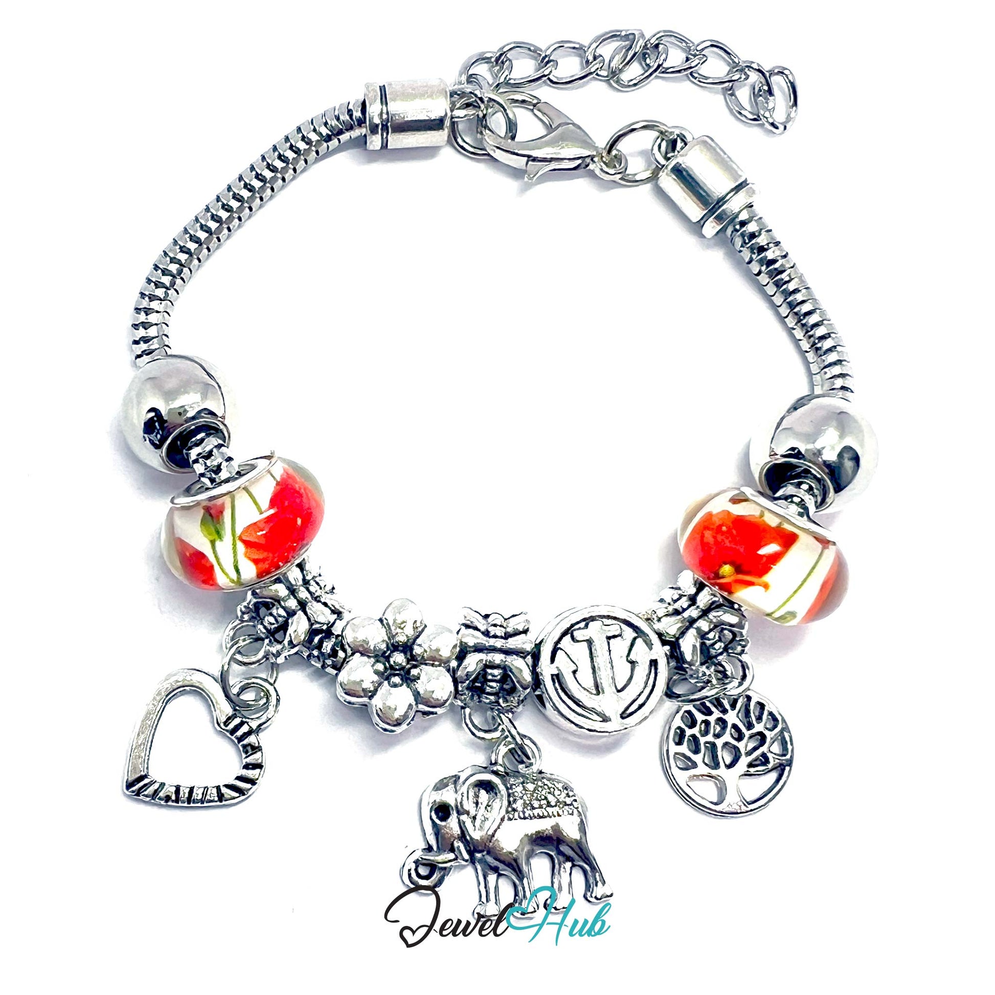 Silver charm bracelet with various charms on a white background