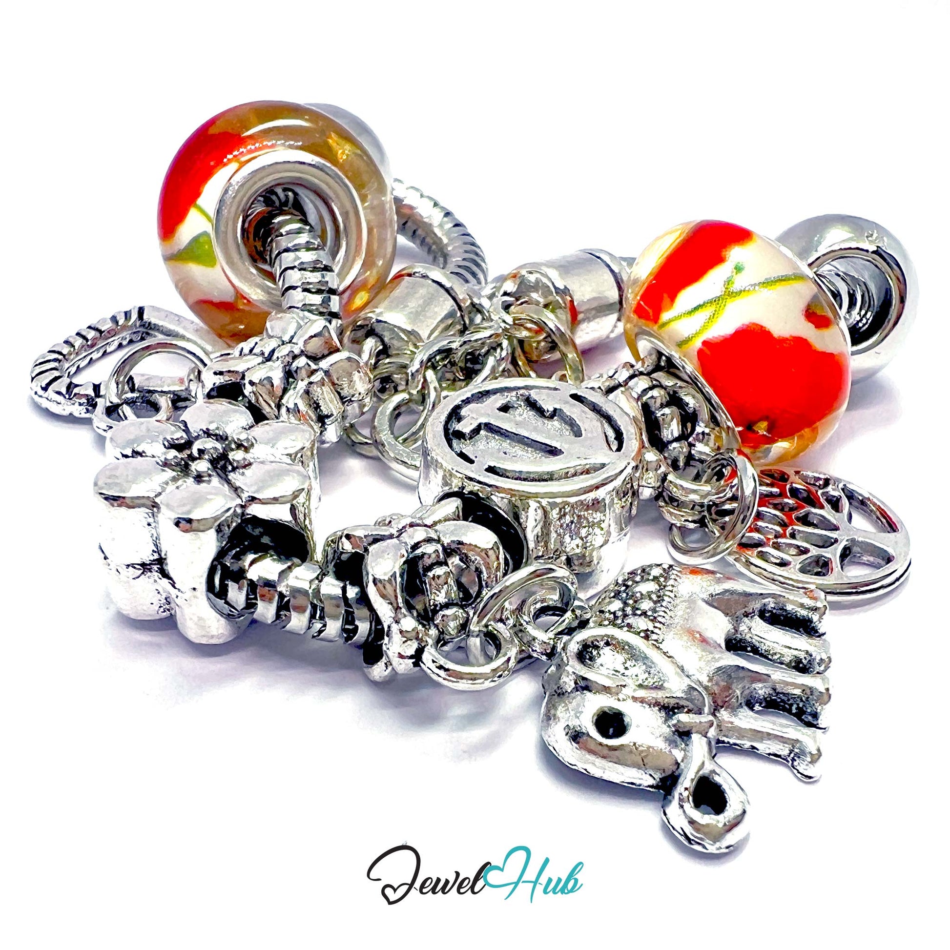 Collection of silver charms and beads with colorful marbled beads on a white background, branded 'Jewel Hub'.