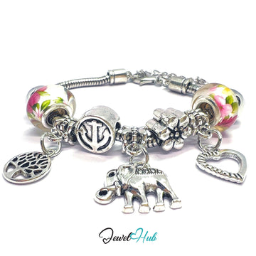 Bracelet with various charms including a heart, elephant, and floral beads on a white background.